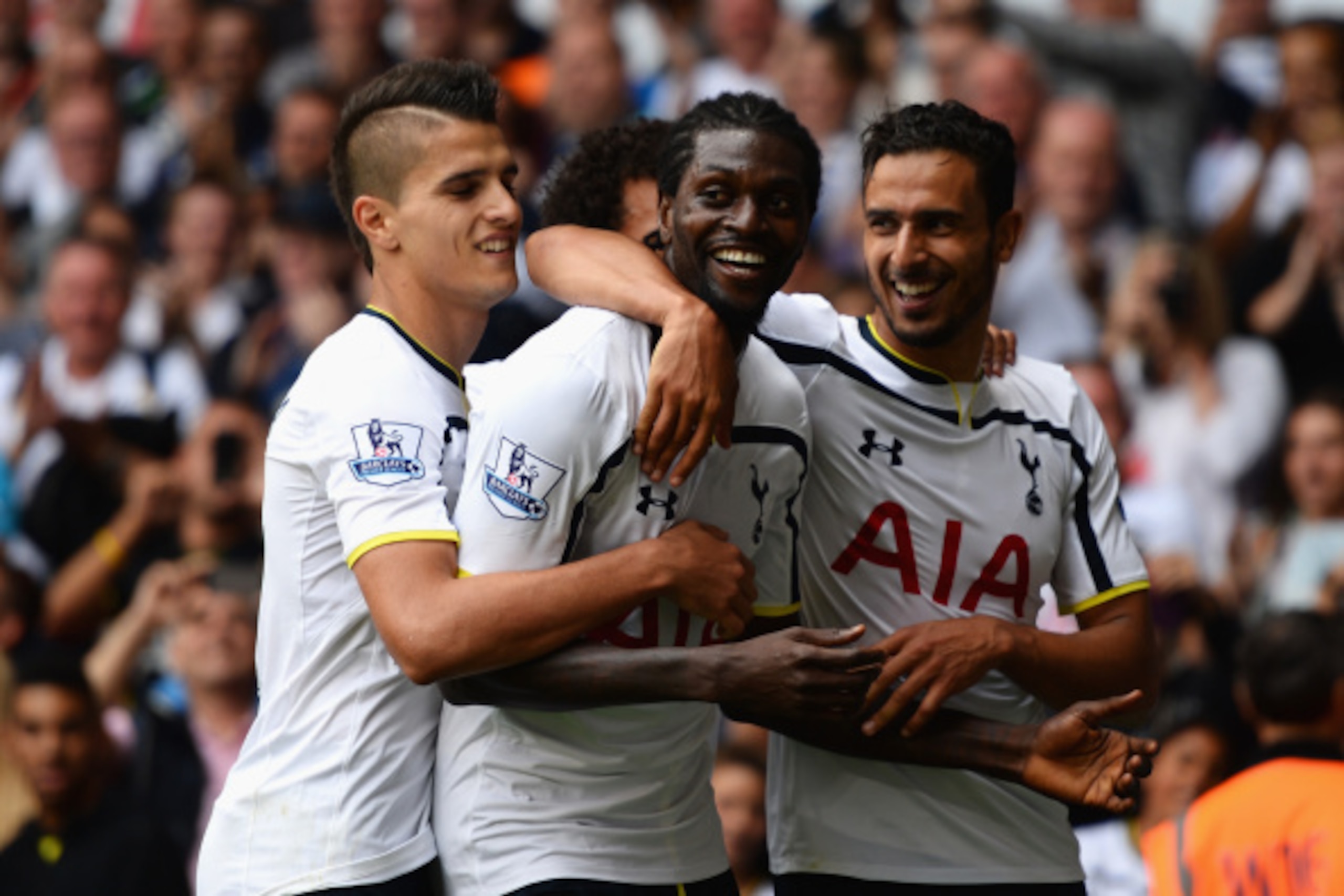 LONDON, ENGLAND - AUGUST 24:  Emmanuel Adebayor of Spurs celebrates his goal with team mates during the Barclays Premier League match between Tottenham Hotspur and Queens Park Rangers at White Hart Lane on August 24, 2014 in London, England.  (Photo by Ja
