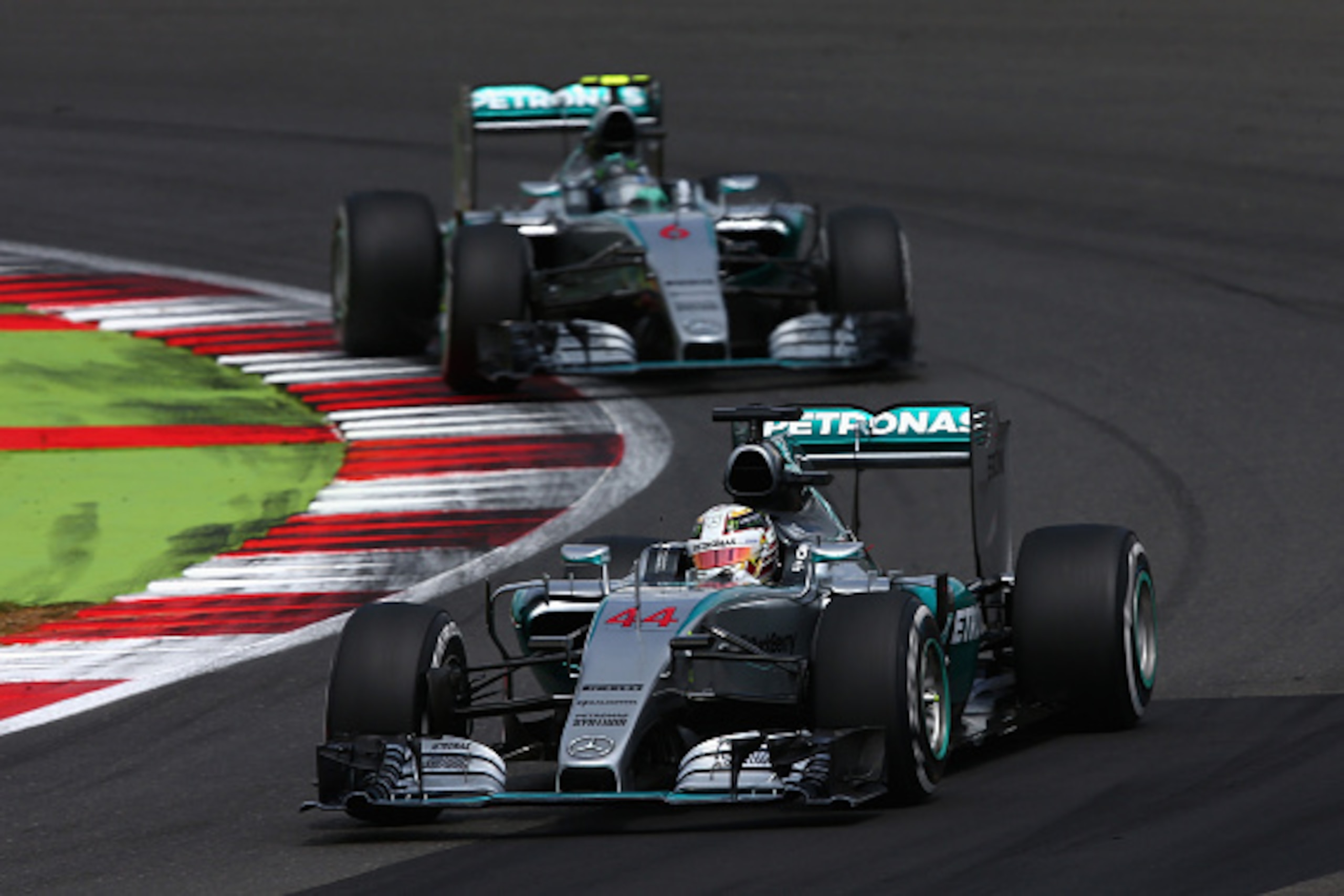 NORTHAMPTON, ENGLAND - JULY 05: Lewis Hamilton of Great Britain and Mercedes GP drives ahead of Nico Rosberg of Germany and Mercedes GP during the Formula One Grand Prix of Great Britain at Silverstone Circuit on July 5, 2015 in Northampton, England. (P NORTHAMPTON, ENGLAND - JULY 05: Lewis Hamilton of Great Britain and Mercedes GP drives ahead of Nico Rosberg of Germany and Mercedes GP during the Formula One Grand Prix of Great Britain at Silverstone Circuit on July 5, 2015 in Northampton, England. (P
