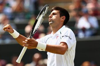 LONDON, ENGLAND - JULY 07:  Novak Djokovic of Serbia celebrates after winning his Gentlemens Singles Fourth Round match against Kevin Anderson of South Africa during day eight of the Wimbledon Lawn Tennis Championships at the All England Lawn Tennis and C