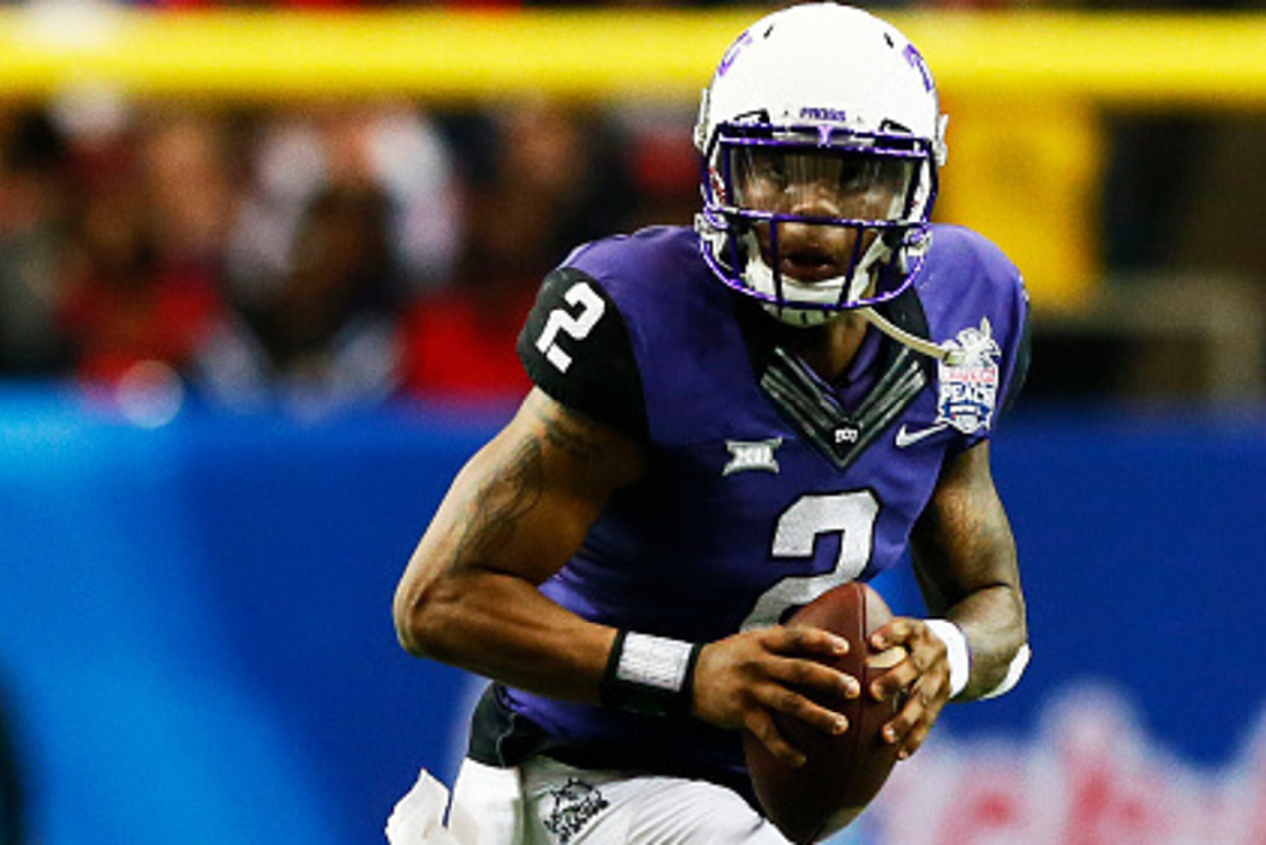 ATLANTA, GA - DECEMBER 31:  Trevone Boykin #2 of the TCU Horned Frogs looks to pass against the Ole Miss Rebels during the Chik-fil-A Peach Bowl at Georgia Dome on December 31, 2014 in Atlanta, Georgia.  (Photo by Kevin C. Cox/Getty Images)