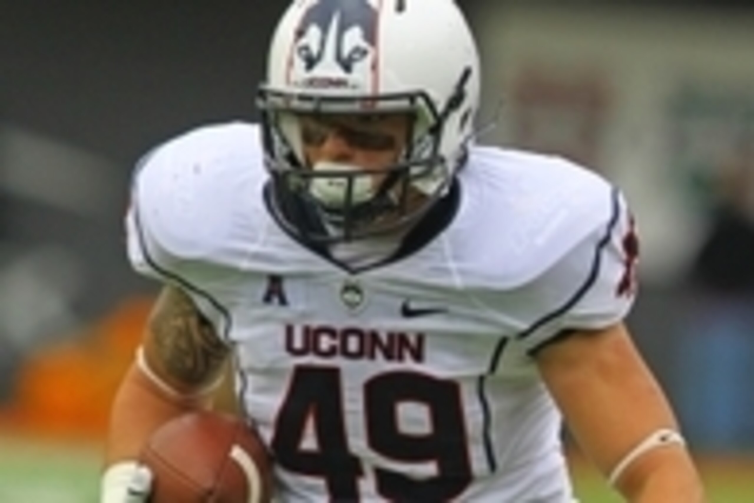 Oct 19, 2013; Cincinnati, OH, USA; Connecticut Huskies running back Sean McQuillan (49) carries the ball during the 4th quarter of the game against the Cincinnati Bearcats at Nippert Stadium. Mandatory Credit: Rob Leifheit-USA TODAY Sports Oct 19, 2013; Cincinnati, OH, USA; Connecticut Huskies running back Sean McQuillan (49) carries the ball during the 4th quarter of the game against the Cincinnati Bearcats at Nippert Stadium. Mandatory Credit: Rob Leifheit-USA TODAY Sports