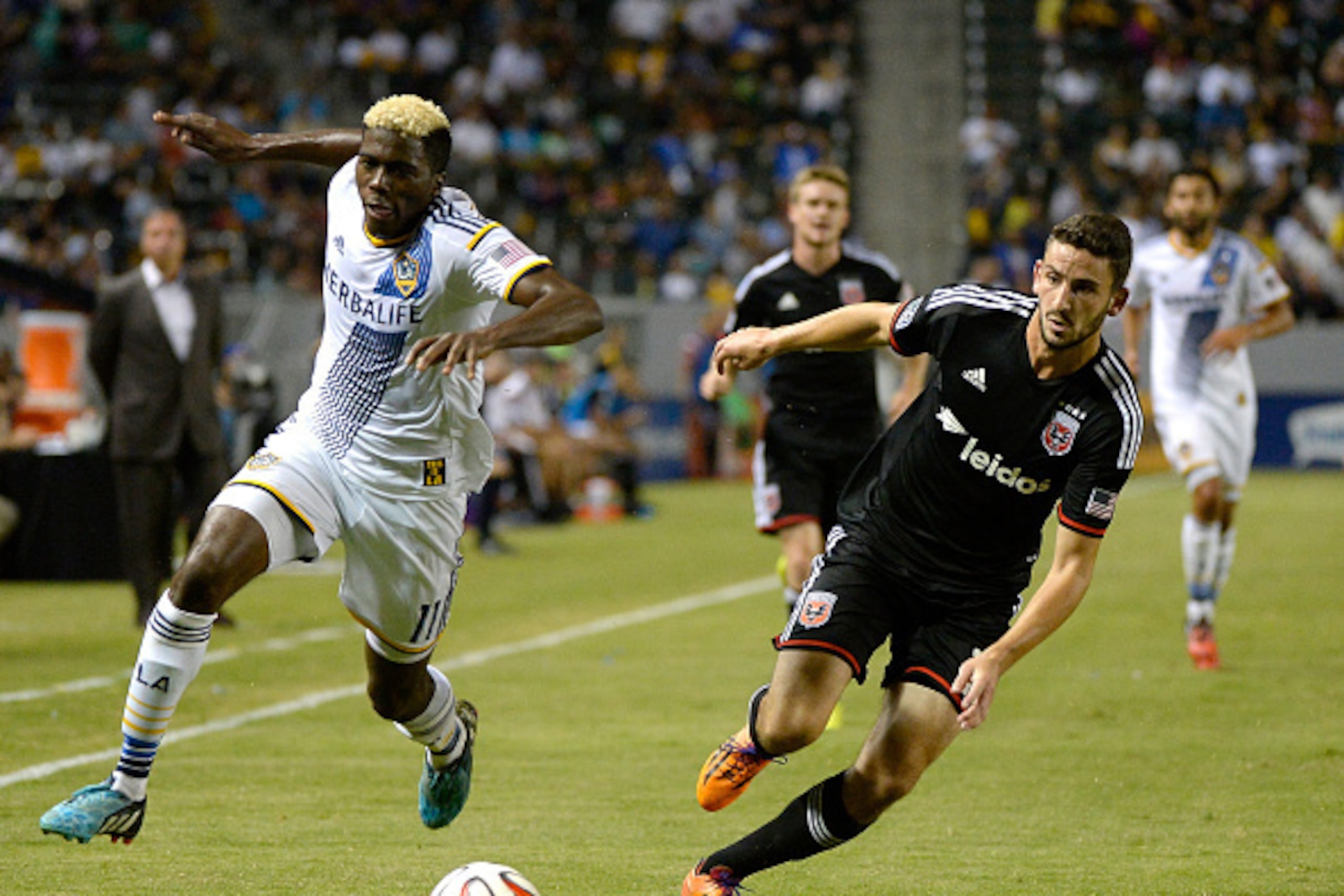 LOS ANGELES, CA - AUGUST 27:  Gyasi Zardes #11 of the Los Angeles Galaxy and Steve Birnbaum #15 of D.C. United chase after a ball during the second half against D.C United at StubHub Center on August 27, 2014 in Los Angeles, California.  (Photo by Harry H