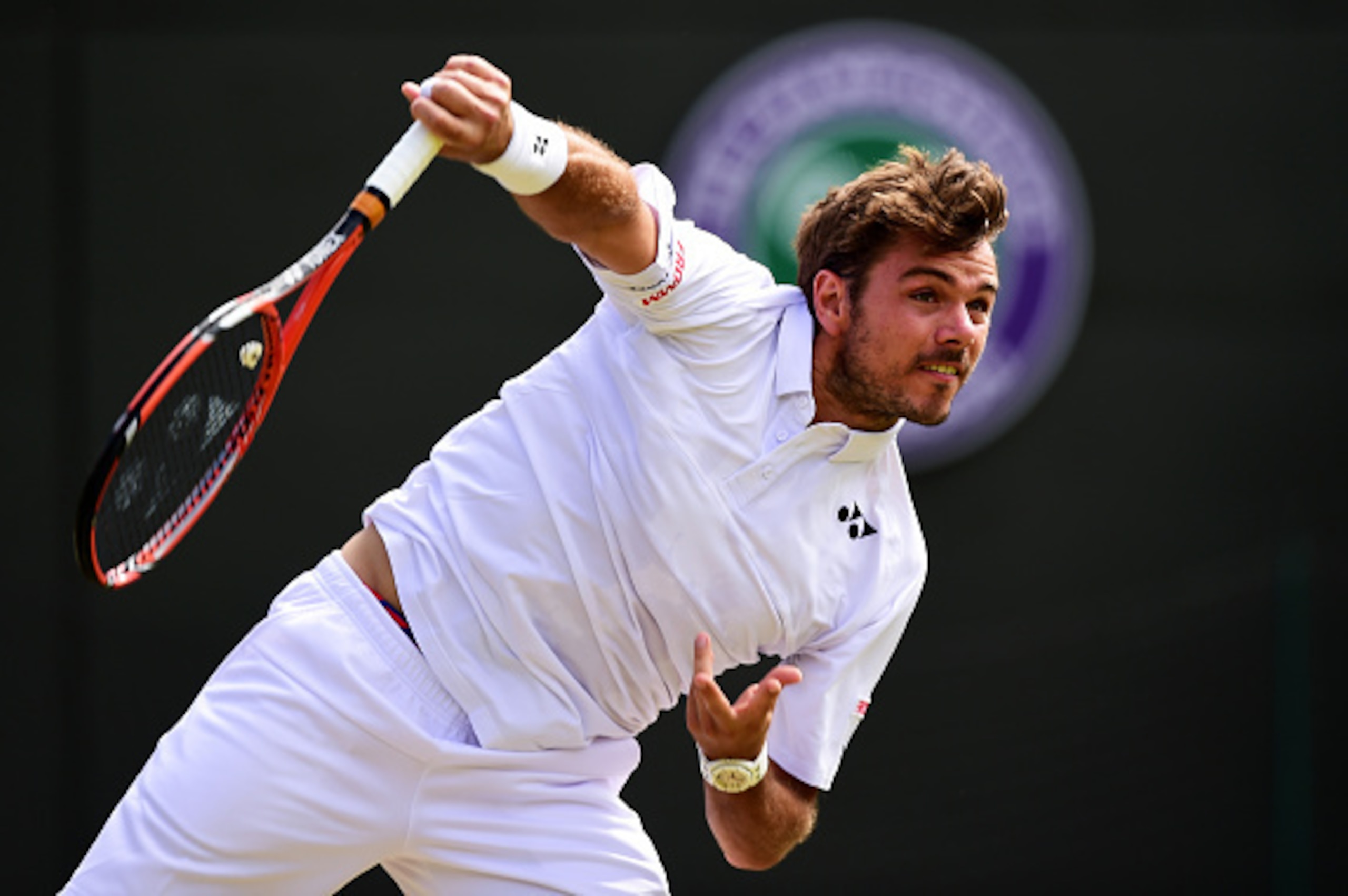 LONDON, ENGLAND - JULY 06:  Stanislas Wawrinka of Switzerland serves in his Gentlemen's Singles Fourth Round match against David Goffin of Belgium during day seven of the Wimbledon Lawn Tennis Championships at the All England Lawn Tennis and Croquet Club 
