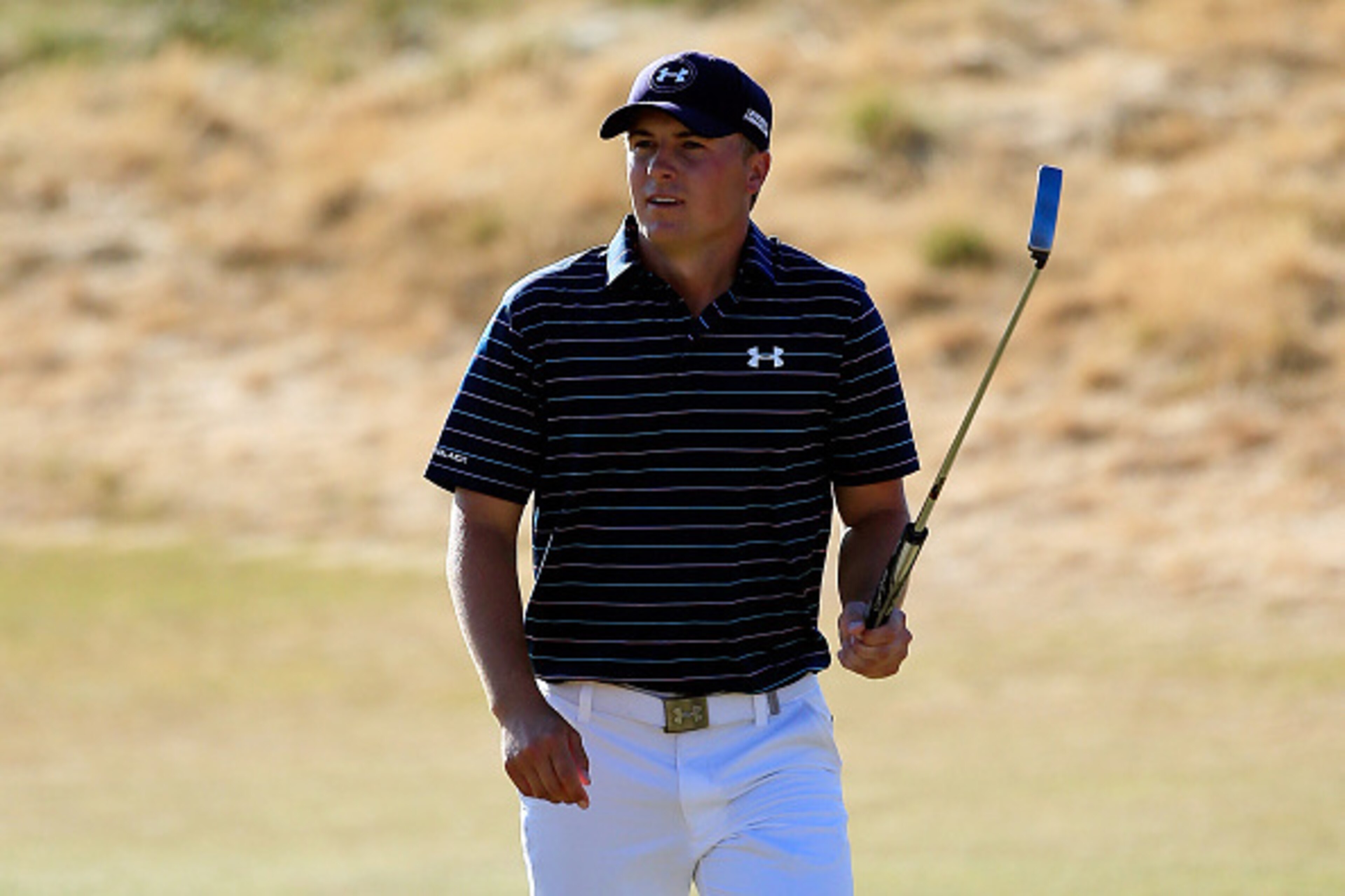 UNIVERSITY PLACE, WA - JUNE 21:  Jordan Spieth of the United States waves to the gallery as he walks across the 18th green during the final round of the 115th U.S. Open Championship at Chambers Bay on June 21, 2015 in University Place, Washington.  (Photo