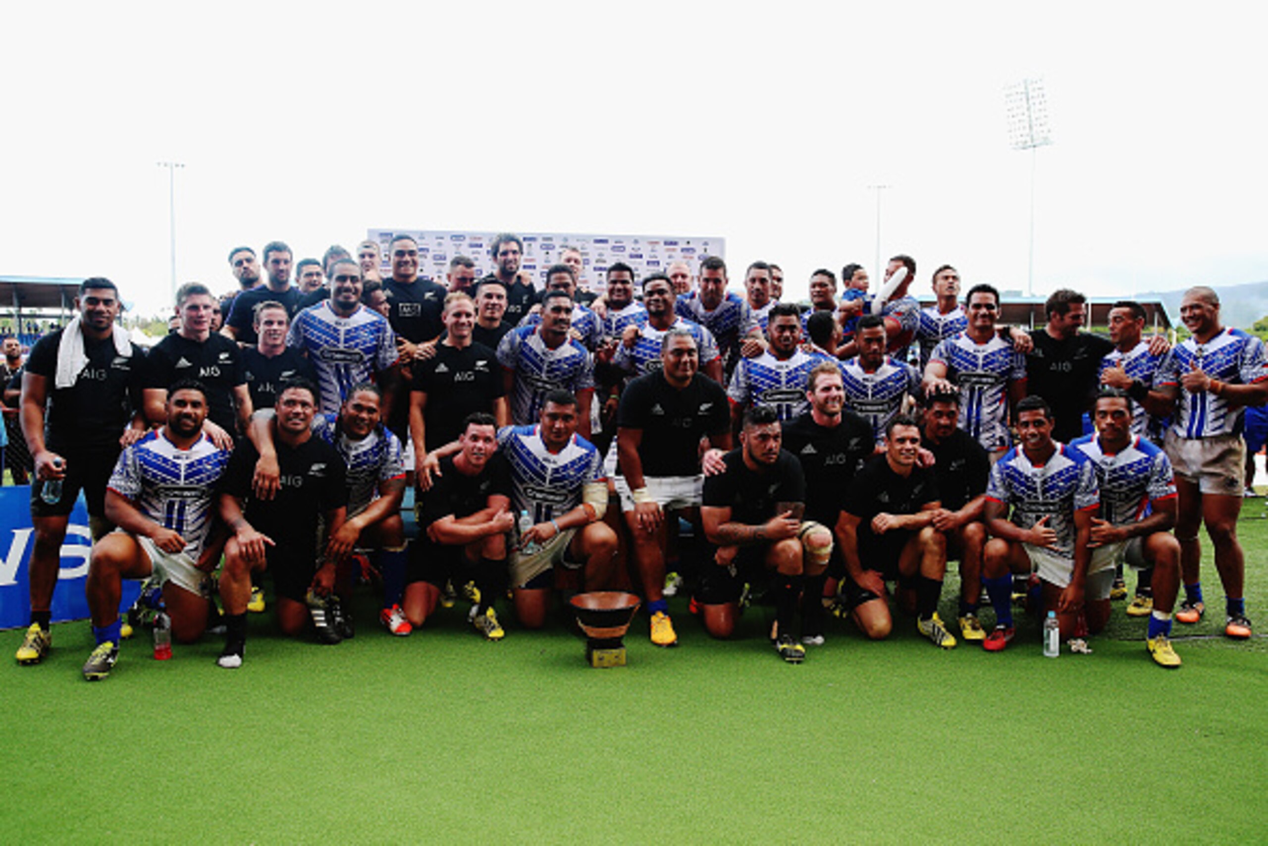 APIA, SAMOA - JULY 08: The New Zealand All Blacks and Samoa pose for a photo following the International Test match between Samoa and the New Zealand All Blacks at Apia Stadium on July 8, 2015 in Apia, Samoa.  (Photo by Hannah Peters/Getty Images)