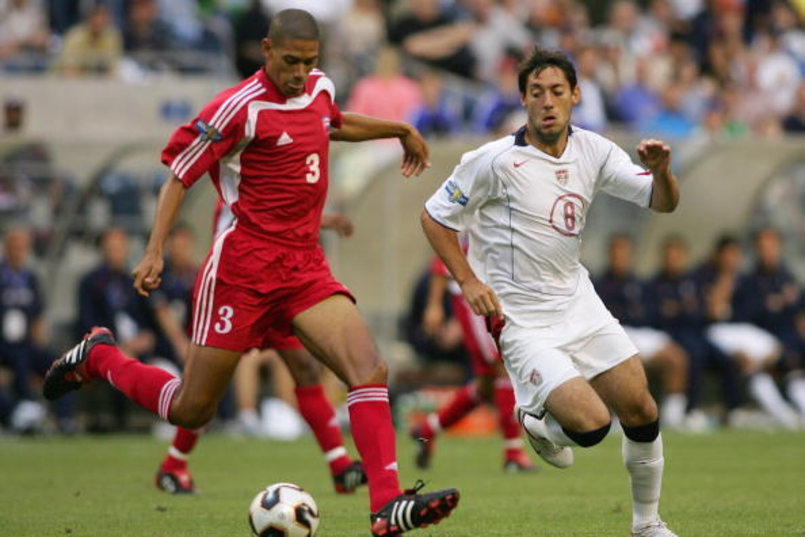 SEATTLE - JULY 7:  Clint Dempsey #8 of the United States chases after Yenier Marquez #3 of Cuba during the preliminary rounds of the CONCACAF Gold Cup on July 7, 2005 at Qwest Field in Seattle, Washington. (Photo by Jonathan Ferrey/Getty Images)