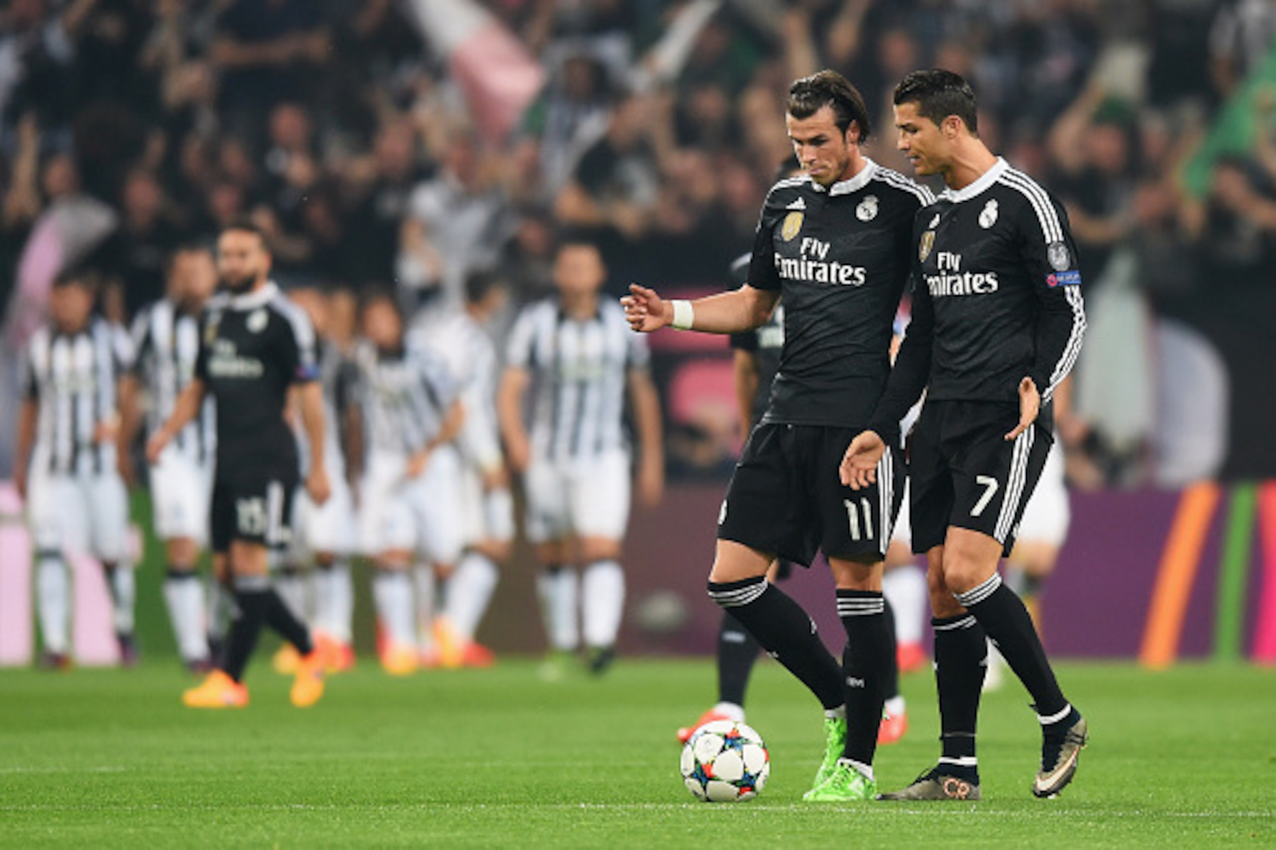 TURIN, ENGLAND - MAY 05:  Gareth Bale and Cristiano Ronaldo of Real Madrid CF in discussion as Alvaro Morata of Juventus scores their first goal during the UEFA Champions League semi final first leg match between Juventus and Real Madrid CF at Juventus Ar