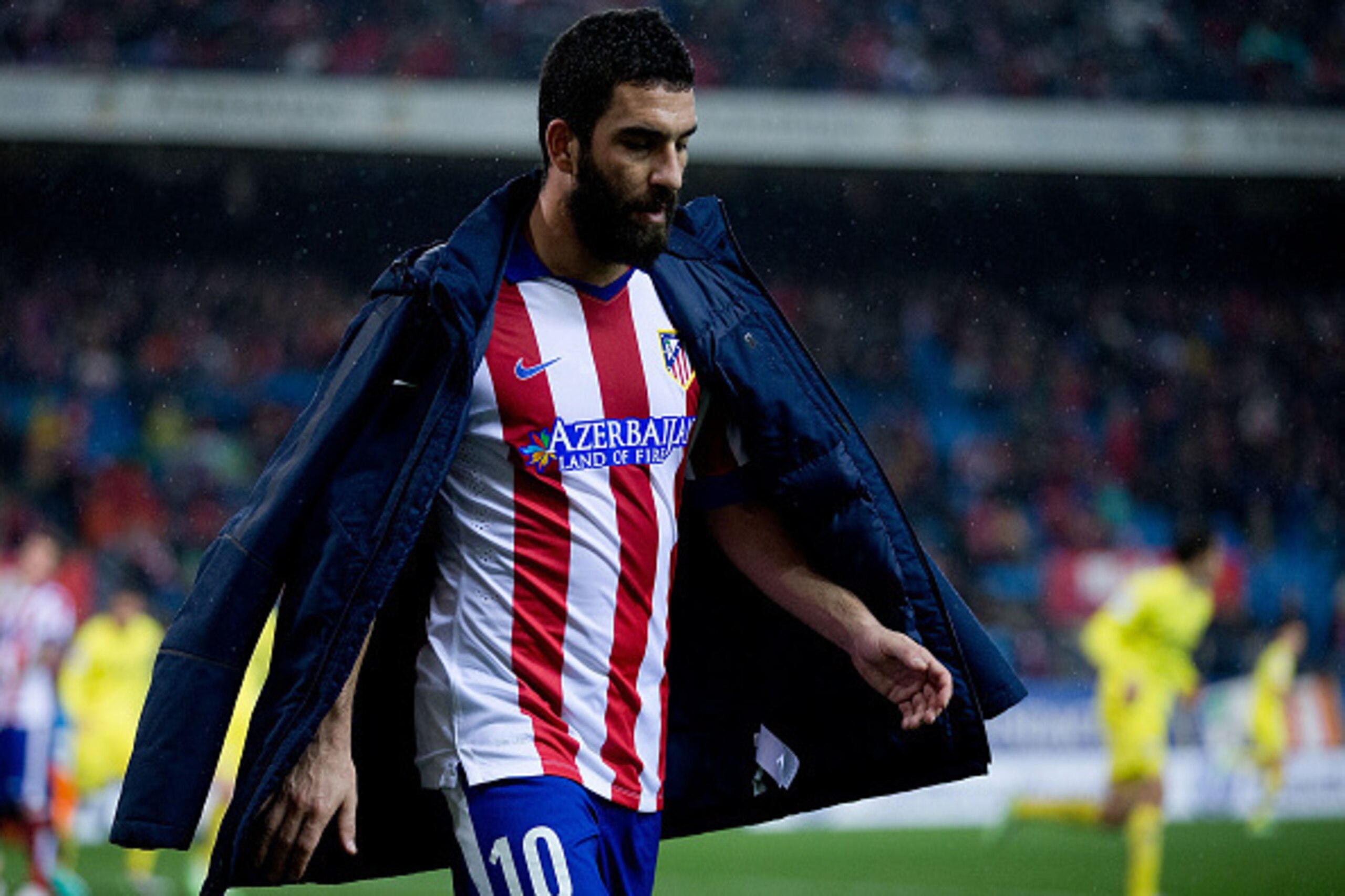 MADRID, SPAIN - DECEMBER 14: Arda Turan of Atletico de Madrid leaves the picth during the La Liga match between Club Atletico de Madrid and Villarreal CF at Vicente Calderon Stadium on December 14, 2014 in Madrid, Spain.  (Photo by Gonzalo Arroyo Moreno/G