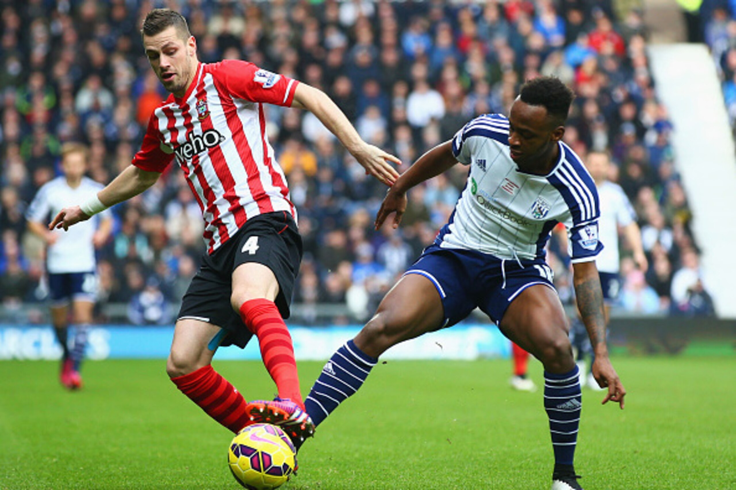 WEST BROMWICH, ENGLAND - FEBRUARY 28:  Saido Berahino of West Bromwich Albion and Morgan Schneiderlin of Southampton battle for the ball during the Barclays Premier League match between West Bromwich Albion and Southampton at The Hawthorns on February 28,