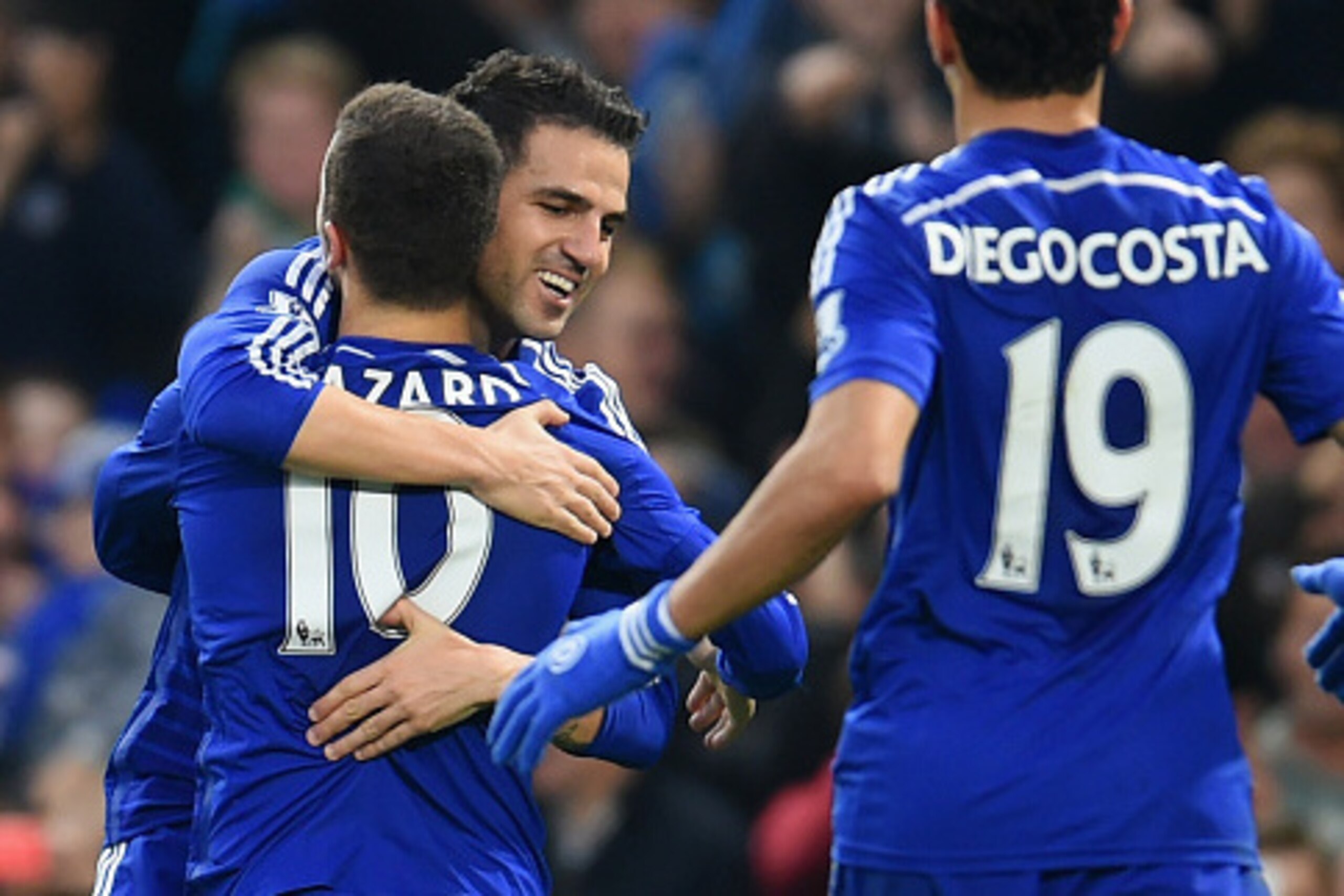 LONDON, ENGLAND - NOVEMBER 22:  Cesc Fabregas of Chelsea hugs Eden Hazard of Chelsea after he scored their second goal during the Barclays Premier League match between Chelsea and West Bromwich Albion at Stamford Bridge on November 22, 2014 in London, Eng