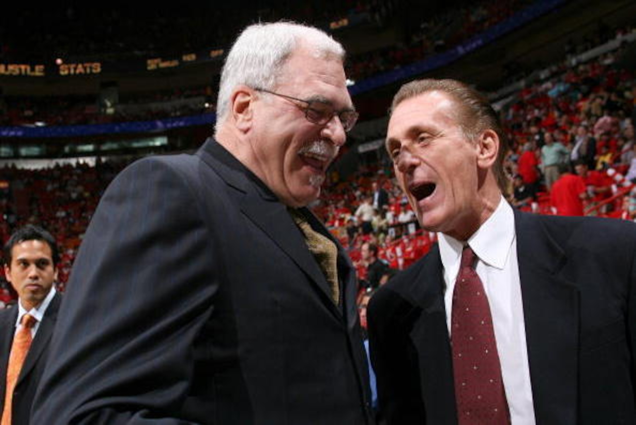 MIAMI - DECEMBER 25: (L-R) Head Coach of the Los Angeles Lakers Phil Jackson and Head Coach of the Miami Heat Pat Riley share a laugh before the game on December 25, 2005 at American Airlines Arena in Miami, Florida. The Heat defeated the Lakers 97-92. MIAMI - DECEMBER 25: (L-R) Head Coach of the Los Angeles Lakers Phil Jackson and Head Coach of the Miami Heat Pat Riley share a laugh before the game on December 25, 2005 at American Airlines Arena in Miami, Florida. The Heat defeated the Lakers 97-92.