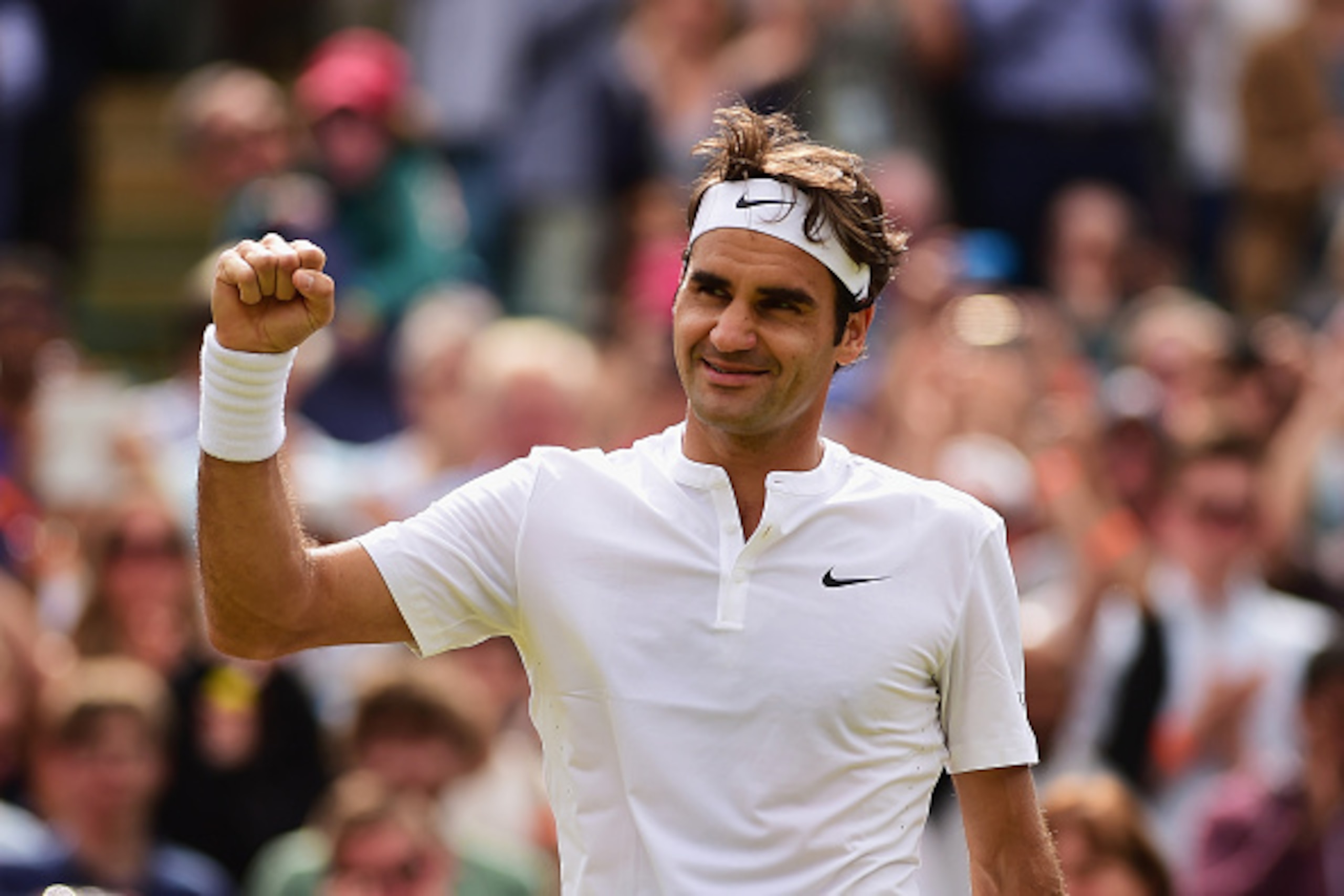 LONDON, ENGLAND - JULY 08: Roger Federer of Switzerland celebrates winning after match point in his Gentlemens Singles Quarter Final match against Gilles Simon of France during day nine of the Wimbledon Lawn Tennis Championships at the All England Lawn T LONDON, ENGLAND - JULY 08: Roger Federer of Switzerland celebrates winning after match point in his Gentlemens Singles Quarter Final match against Gilles Simon of France during day nine of the Wimbledon Lawn Tennis Championships at the All England Lawn T