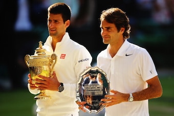 LONDON, ENGLAND - JULY 06:  Novak Djokovic of Serbia poses with the Gentlemen's Singles Trophy next to Roger Federer of Switzerland following his victory in the Gentlemen's Singles Final match on day thirteen of the Wimbledon Lawn Tennis Championships at 