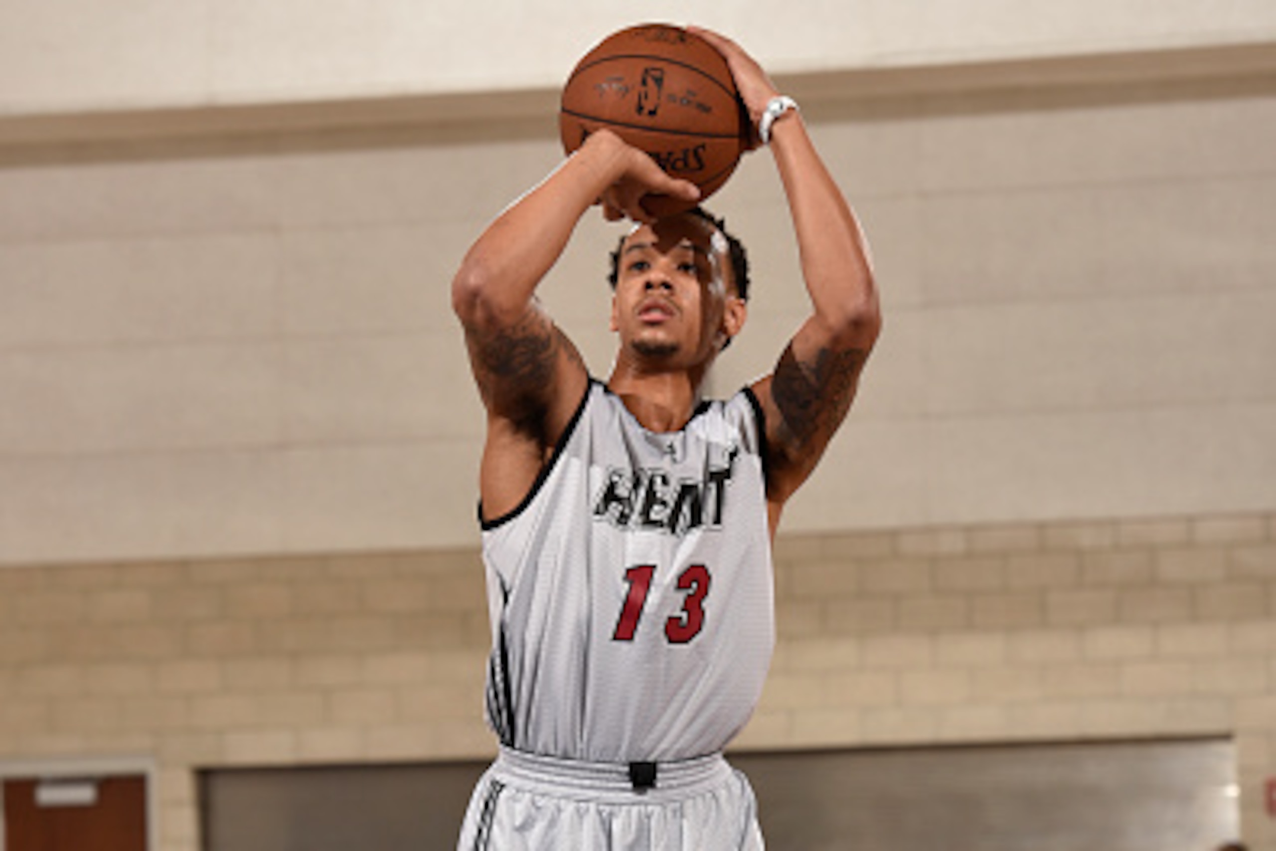 ORLANDO, FL - JULY 8:  Shabazz Napier #13 of the Miami Heat shoots a free throw against the Los Angeles Clippers in a 2015 NBA Orlando Pro Summer League game on July 8, 2015 at Amway Center in Orlando, Florida. NOTE TO USER: User expressly acknowledges an