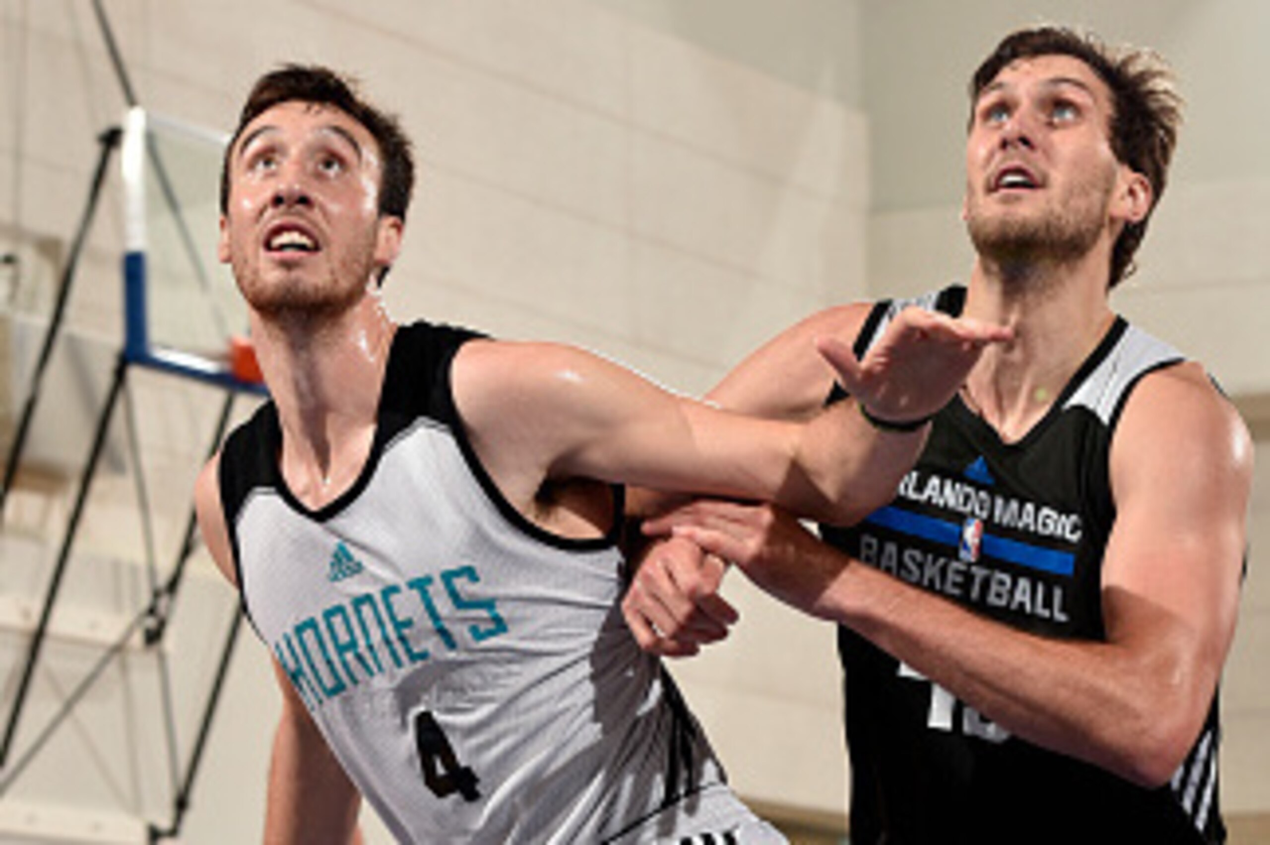 ORLANDO, FL - JULY 8: Frank Kaminsky #4 of the Charlotte Hornets and Jordan Bachynski #43 of the Orlando Magic battle for position on July 8, 2015 at Amway Center in Orlando, Florida. NOTE TO USER: User expressly acknowledges and agrees that, by downloadi