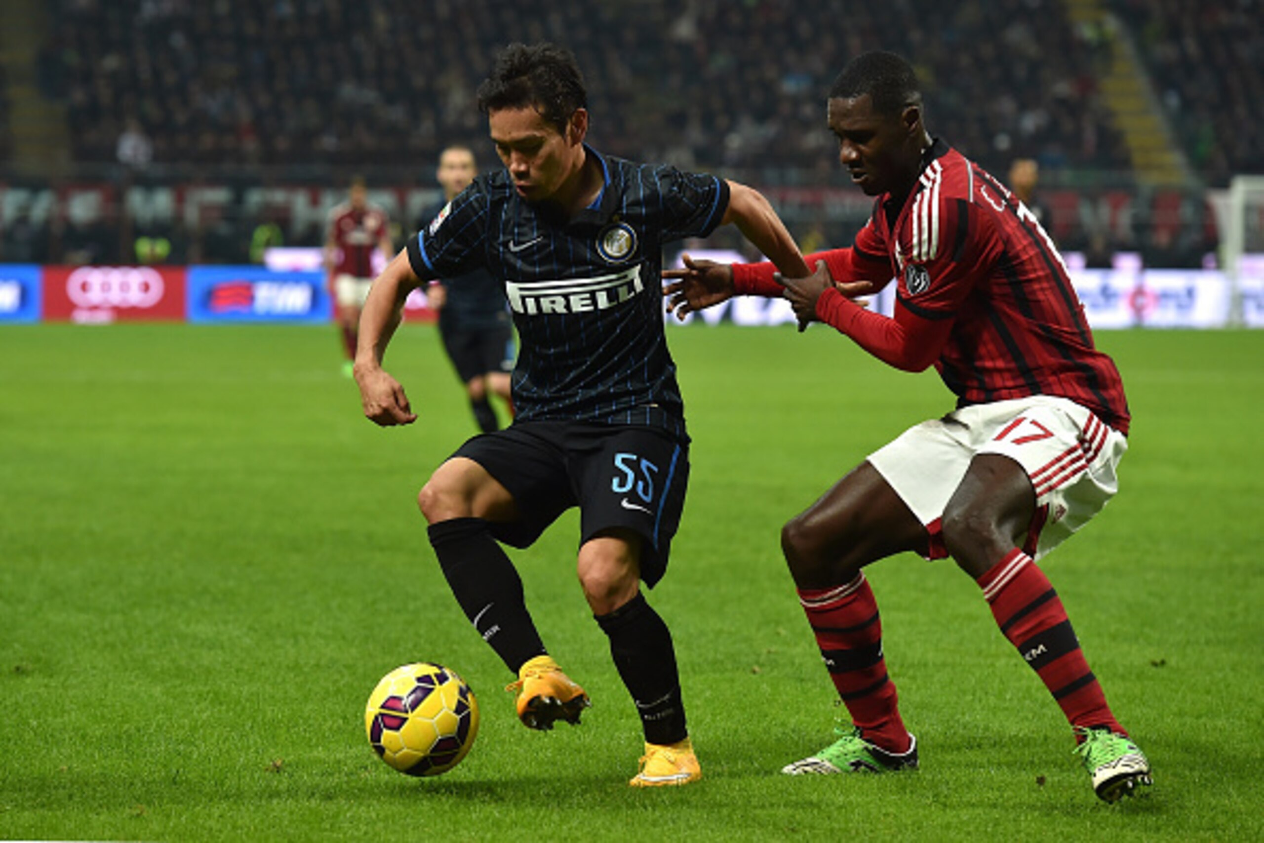 MILAN, ITALY - NOVEMBER 23: Cristian Zapata (R) of AC Milan competes with Yuto Nagatomo of FC Internazionale Milano during the Serie A match between AC Milan and FC Internazionale Milano at Stadio Giuseppe Meazza on November 23, 2014 in Milan, Italy. (P MILAN, ITALY - NOVEMBER 23: Cristian Zapata (R) of AC Milan competes with Yuto Nagatomo of FC Internazionale Milano during the Serie A match between AC Milan and FC Internazionale Milano at Stadio Giuseppe Meazza on November 23, 2014 in Milan, Italy. (P