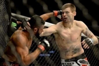 Feb 28, 2015; Los Angeles, CA, USA; Dhiego Lima (red gloves) during his Welterweight bout against Tim Means  (blue gloves) at UFC 184 at Staples Center. Means won on a KO in the first round. Mandatory Credit: Jayne Kamin-Oncea-USA TODAY Sports