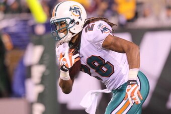 EAST RUTHERFORD, NJ - DECEMBER 12:  Nolan Carroll #28 of the Miami Dolphins rushes against the New York Jets at New Meadowlands Stadium on December 12, 2010 in East Rutherford, New Jersey.  (Photo by Nick Laham/Getty Images)