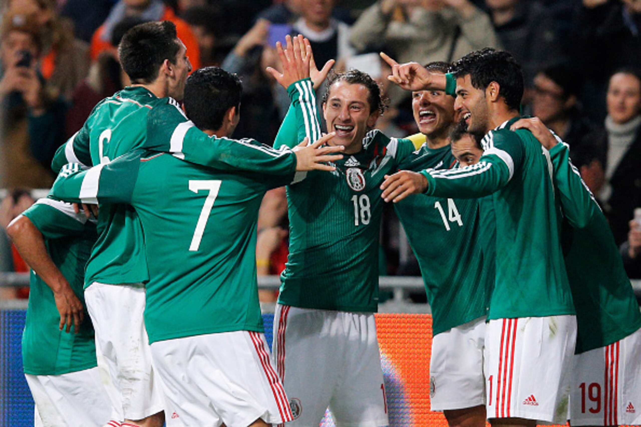 AMSTERDAM, NETHERLANDS - NOVEMBER 12:  Javier Hernandez #14 of Mexico is congratulated by team mates after scoring the third goal of the game for his team during the international friendly match between Netherlands and Mexico held at the Amsterdam ArenA o