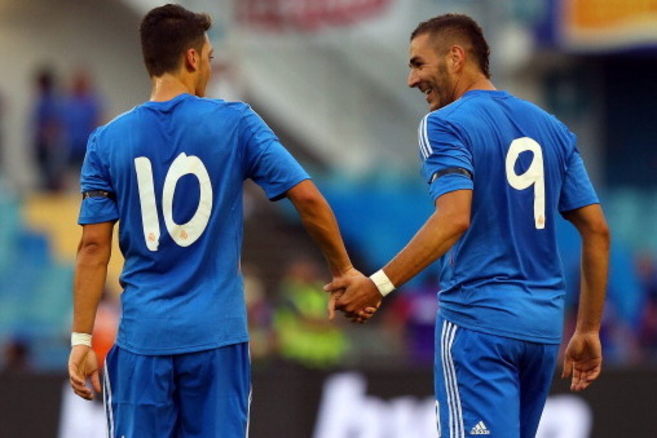 GOTHENBURG, SWEDEN - JULY 27: Karim Benzema (R) of Real Madrid celebrate with team mate Mesut Oezil (L) after he scores his team's opening goal during the pre season friendly match between Real Madrid and Paris Saint-Germain at Ullevi on July 27, 2013 in GOTHENBURG, SWEDEN - JULY 27: Karim Benzema (R) of Real Madrid celebrate with team mate Mesut Oezil (L) after he scores his team's opening goal during the pre season friendly match between Real Madrid and Paris Saint-Germain at Ullevi on July 27, 2013 in
