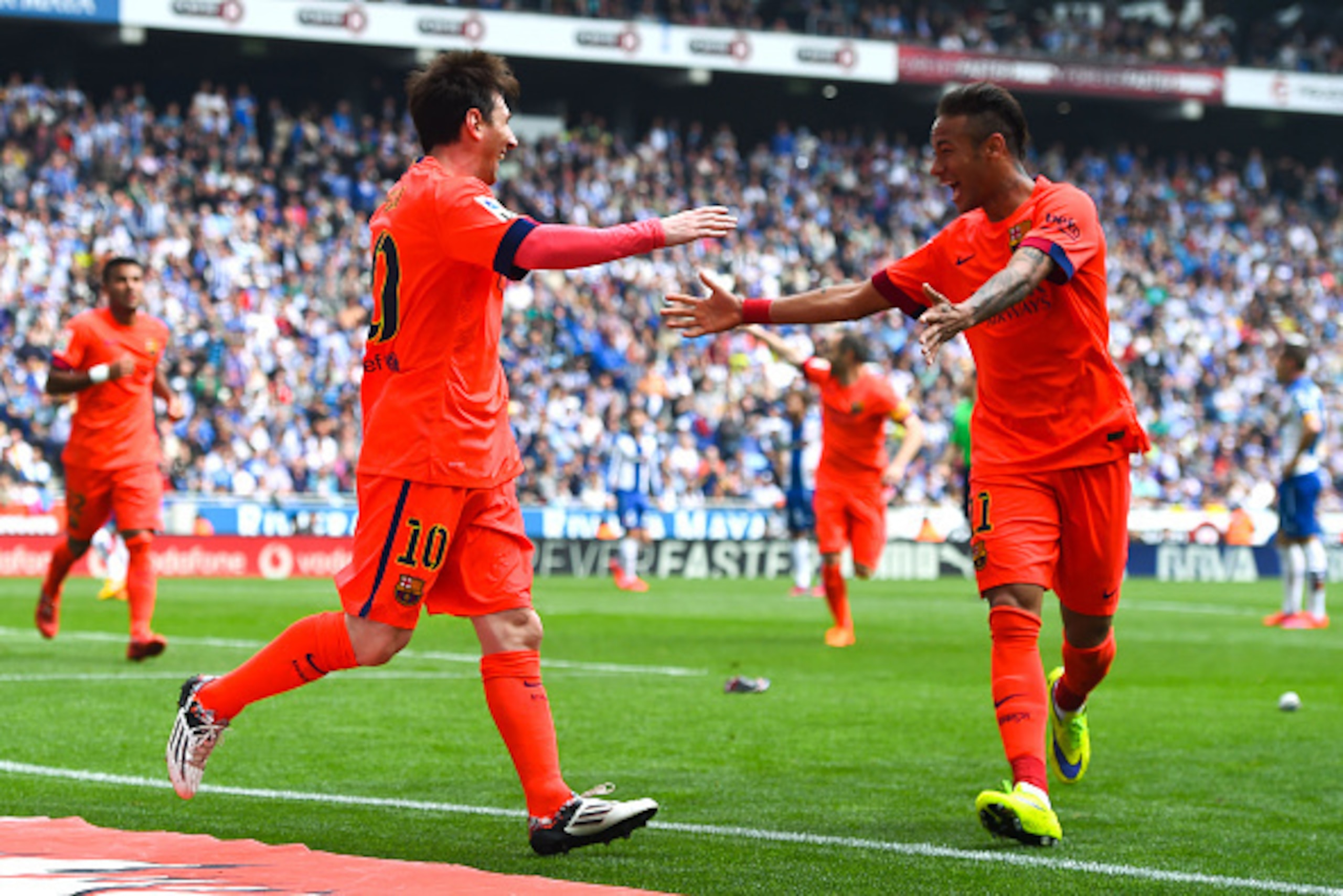 BARCELONA, SPAIN - APRIL 25:  Lionel Messi of FC Barcelona celebrates with his teammate Neymar of FC Barcelona after scoring his team's second goal during the La Liga match between RCD Espanyol and FC Barcelona at Cornella-El Prat Stadium on April 25, 201