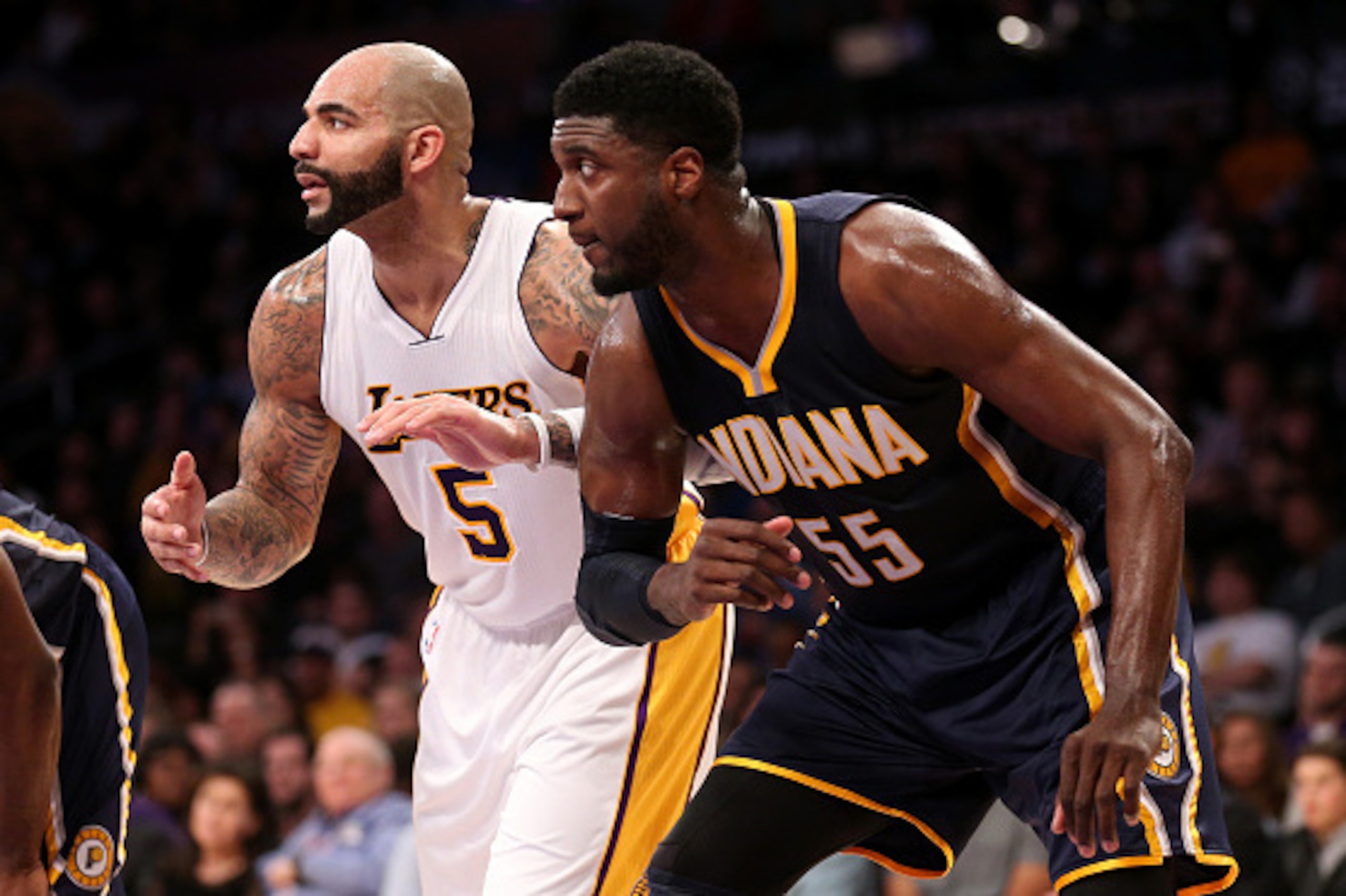 LOS ANGELES, CA - JANUARY 04: Roy Hibbert #55 of the Indiana Pacers and Carlos Boozer #5 of the Los Angeles Lakers battle for rebounding positon on a foul shot at Staples Center on January 4, 2015 in Los Angeles, California. the Lakers won 88-87. NOTE LOS ANGELES, CA - JANUARY 04: Roy Hibbert #55 of the Indiana Pacers and Carlos Boozer #5 of the Los Angeles Lakers battle for rebounding positon on a foul shot at Staples Center on January 4, 2015 in Los Angeles, California. the Lakers won 88-87. NOTE