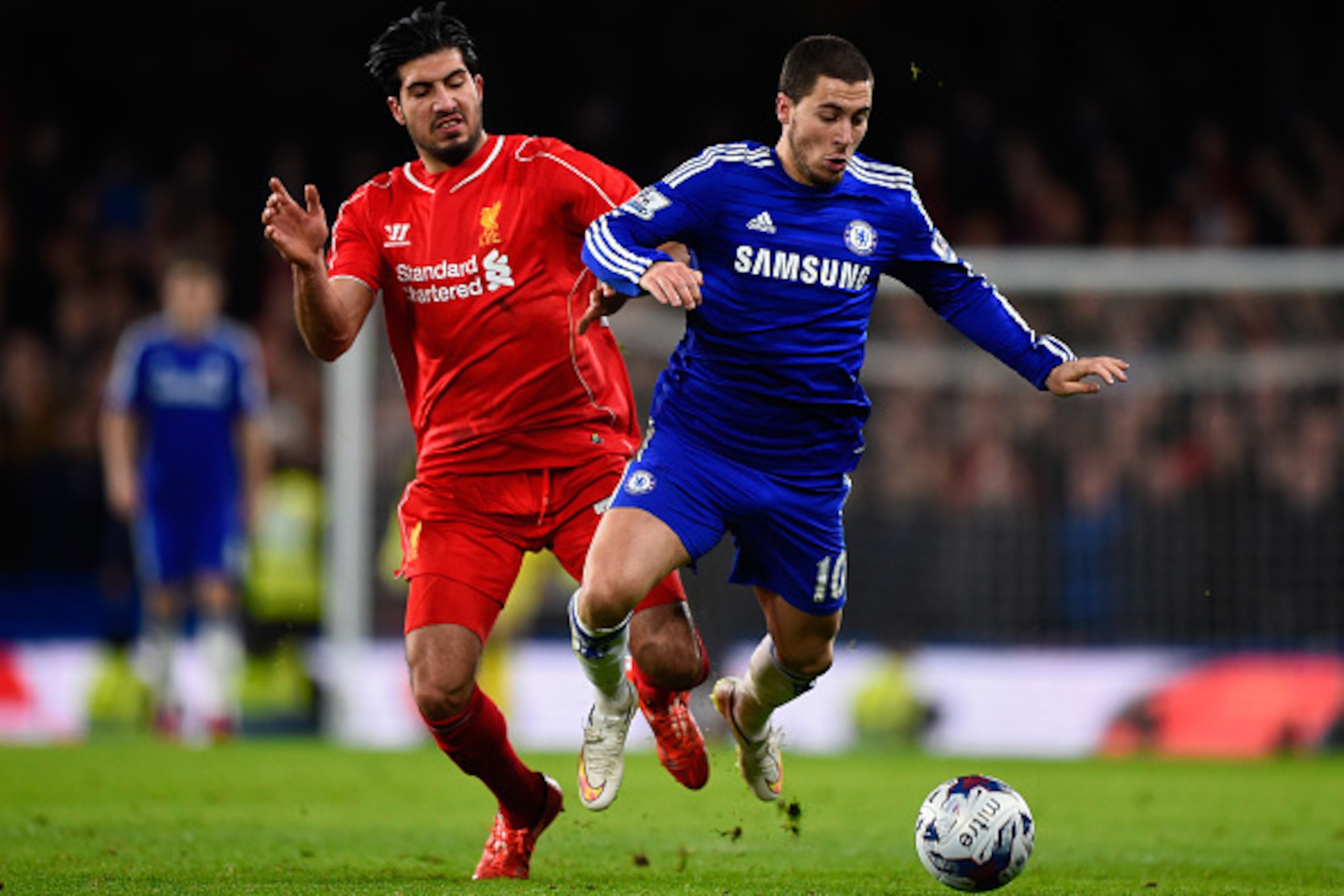 LONDON, ENGLAND - JANUARY 27:  Emre Can of Liverpool and Eden Hazard of Chelsea battle for the ball during the Capital One Cup Semi-Final second leg between Chelsea and Liverpool at Stamford Bridge on January 27, 2015 in London, England.  (Photo by Mike H