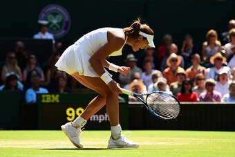 LONDON, ENGLAND - JULY 09:  Garbine Muguruza of Spain celebrates winning a point in the Ladies Singles Semi Final match against Agnieszka Radwanska of Poland  during day ten of the Wimbledon Lawn Tennis Championships at the All England Lawn Tennis and Cro