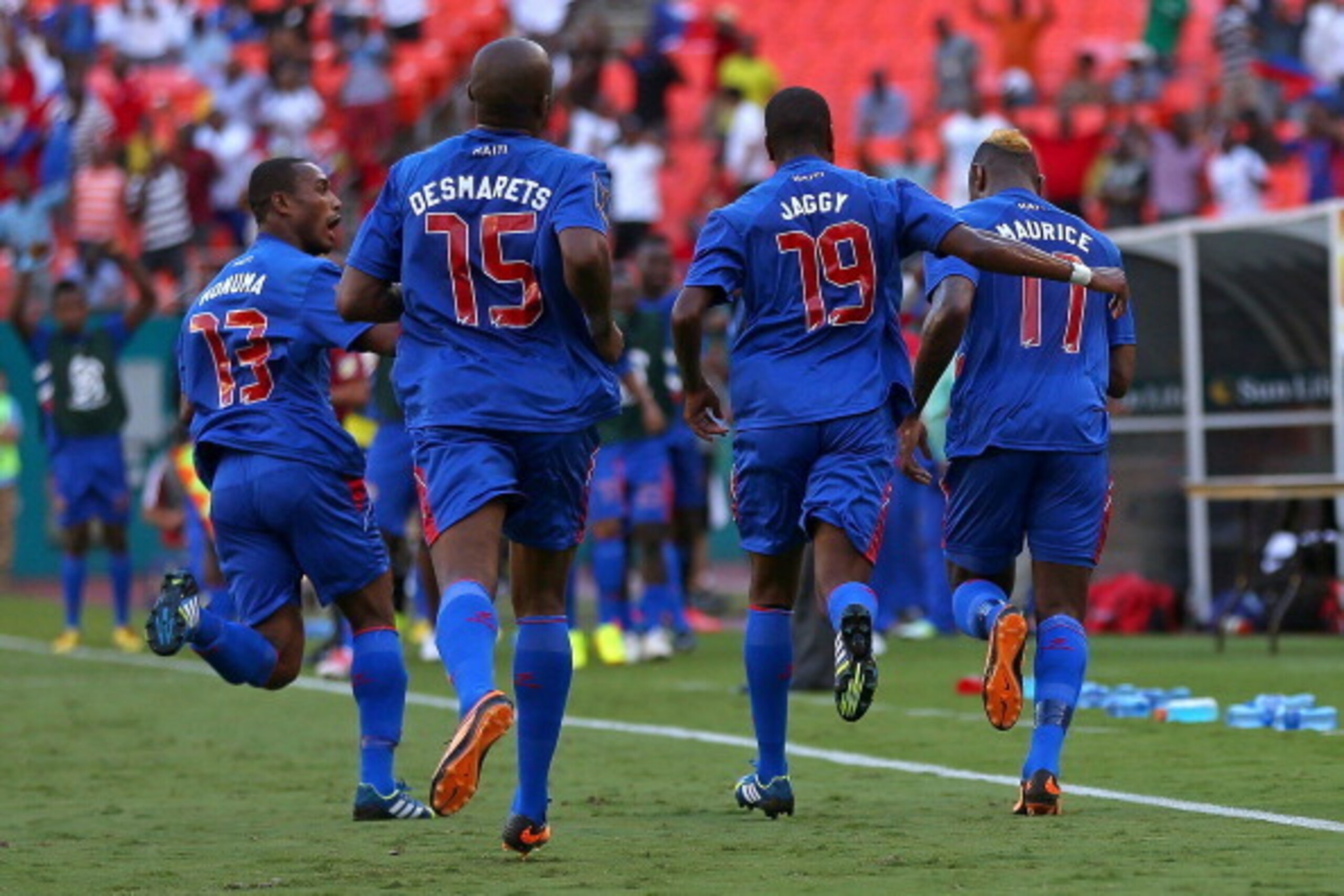 MIAMI GARDENS, FL - JULY 12:  Team Haiti celebrates after scoring a goal by Jean Eudes Maurice #11 during a CONCACAF Gold Cup game against Trinidad & Tobago at Sun Life Stadium on July 12, 2013 in Miami Gardens, Florida.  (Photo by Mike Ehrmann/Getty Imag