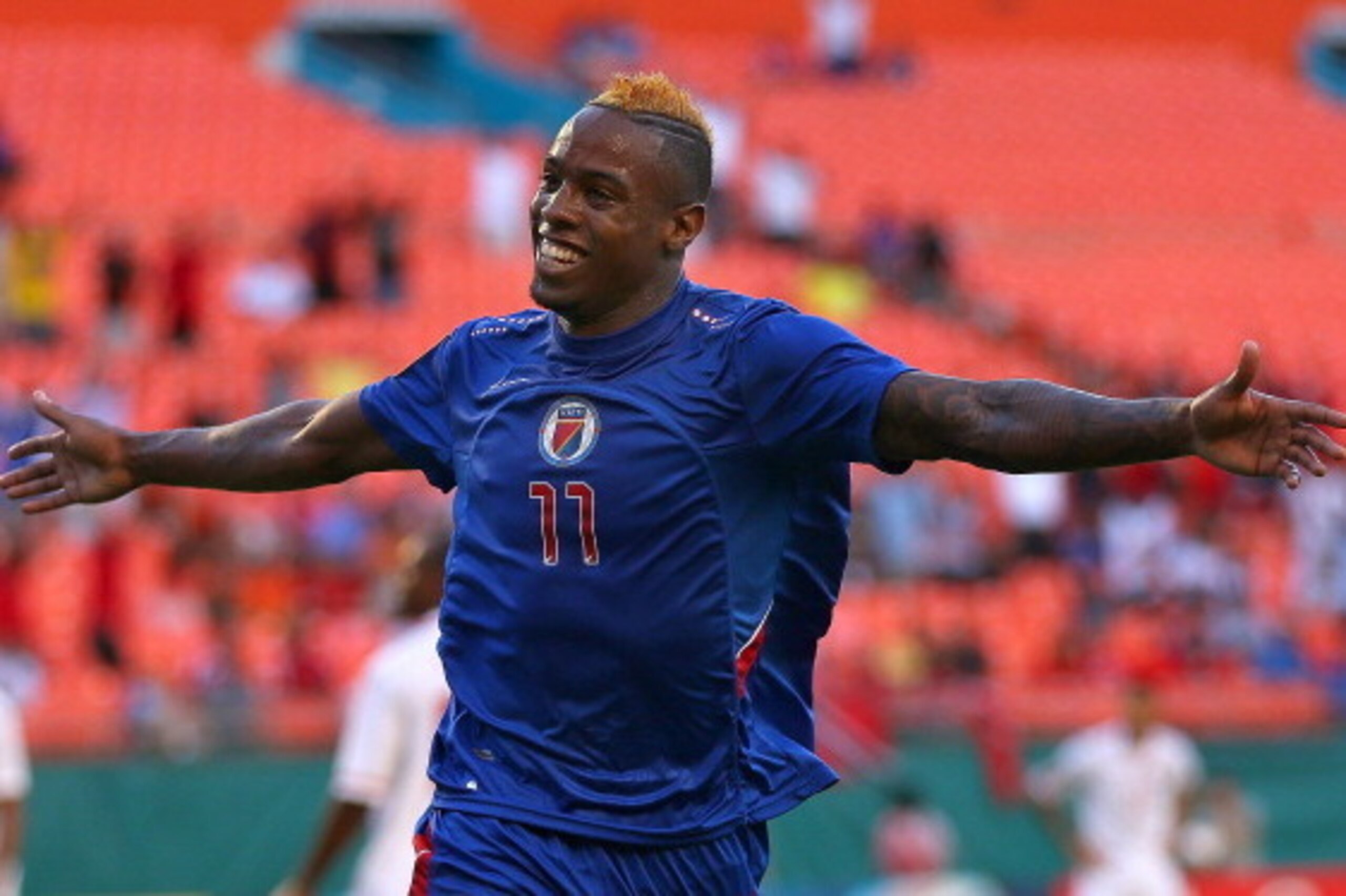 MIAMI GARDENS, FL - JULY 12:  Jean Eudes Maurice #11 of  Haiti celebrates scoring a goal during a CONCACAF Gold Cup game against Trinidad & Tobago at Sun Life Stadium on July 12, 2013 in Miami Gardens, Florida.  (Photo by Mike Ehrmann/Getty Images)