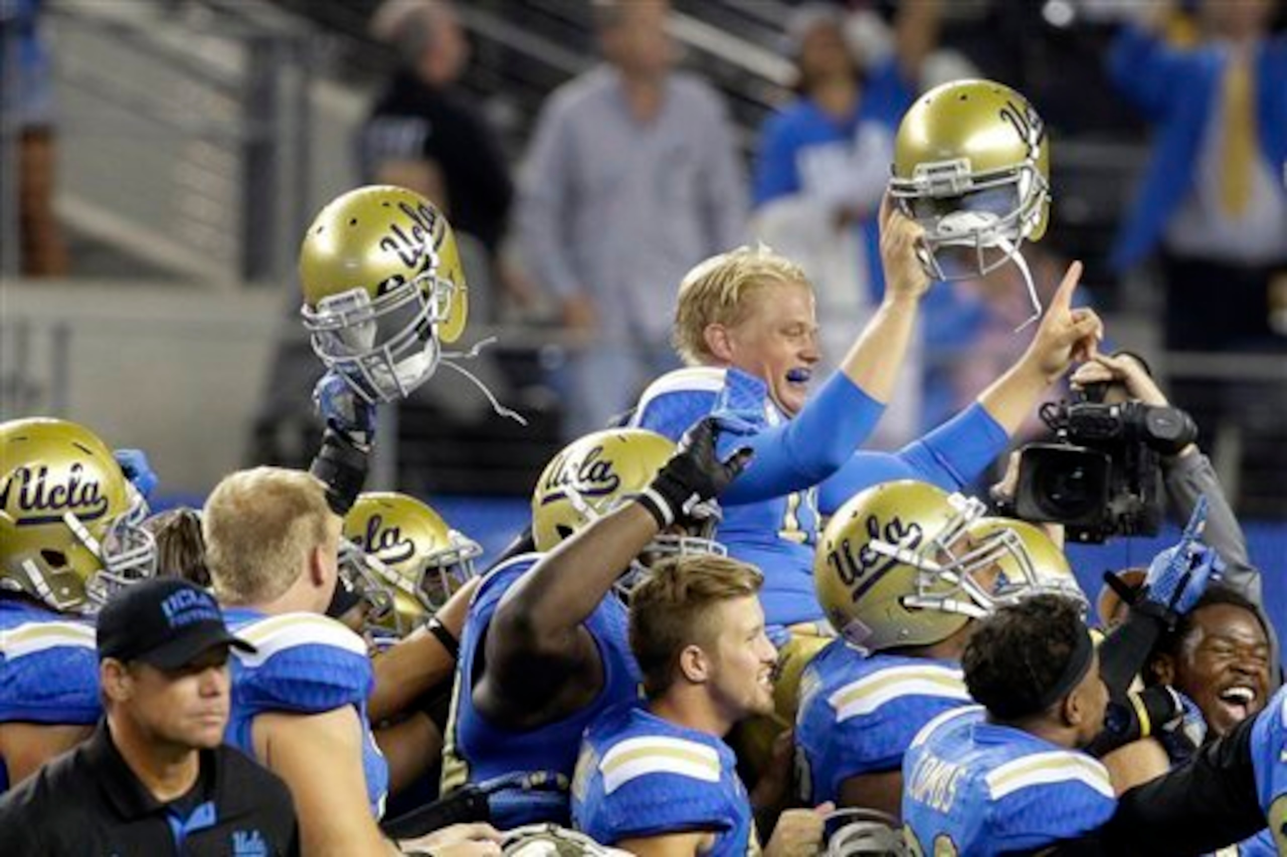 Neuheisel after the win vs. Texas.