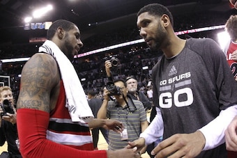 SAN ANTONIO, TX - MAY 14:  Tim Duncan #21 of the San Antonio Spurs and LaMarcus Aldridge #12 of the Portland Trail Blazers shake hands after the Spurs defeat the Trail Blazers 104-82 in Game Five of the Western Conference Semifinals during the 2014 NBA Pl