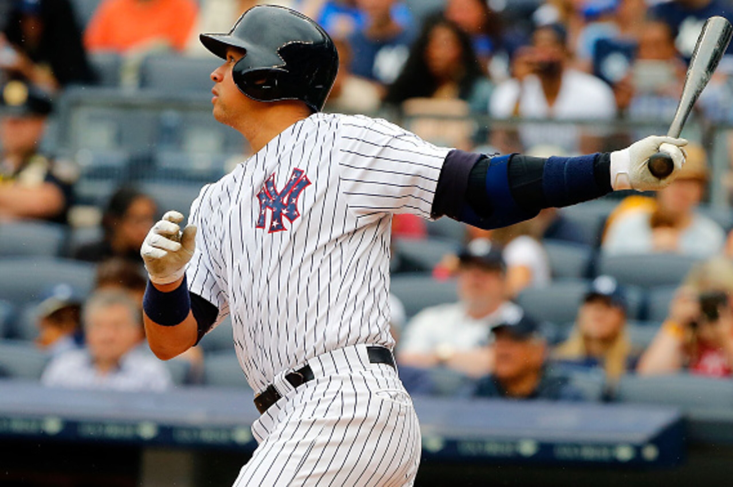 NEW YORK, NY - JULY 04:  Alex Rodriguez #13 of the New York Yankees follows through on a first inning RBI base hit against the Tampa Bay Rays at Yankee Stadium on July 4, 2015 in the Bronx borough of New York City.  (Photo by Jim McIsaac/Getty Images)