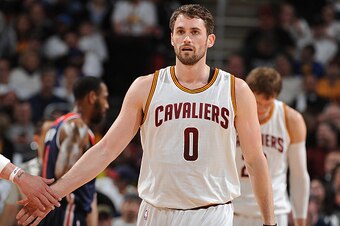 CLEVELAND, OH - APRIL 15:  Kevin Love #0 of the Cleveland Cavaliers shakes hands with his teammates during the game against the Washington Wizards on April 15, 2015 at Quicken Loans Arena in Cleveland, Ohio. NOTE TO USER: User expressly acknowledges and a