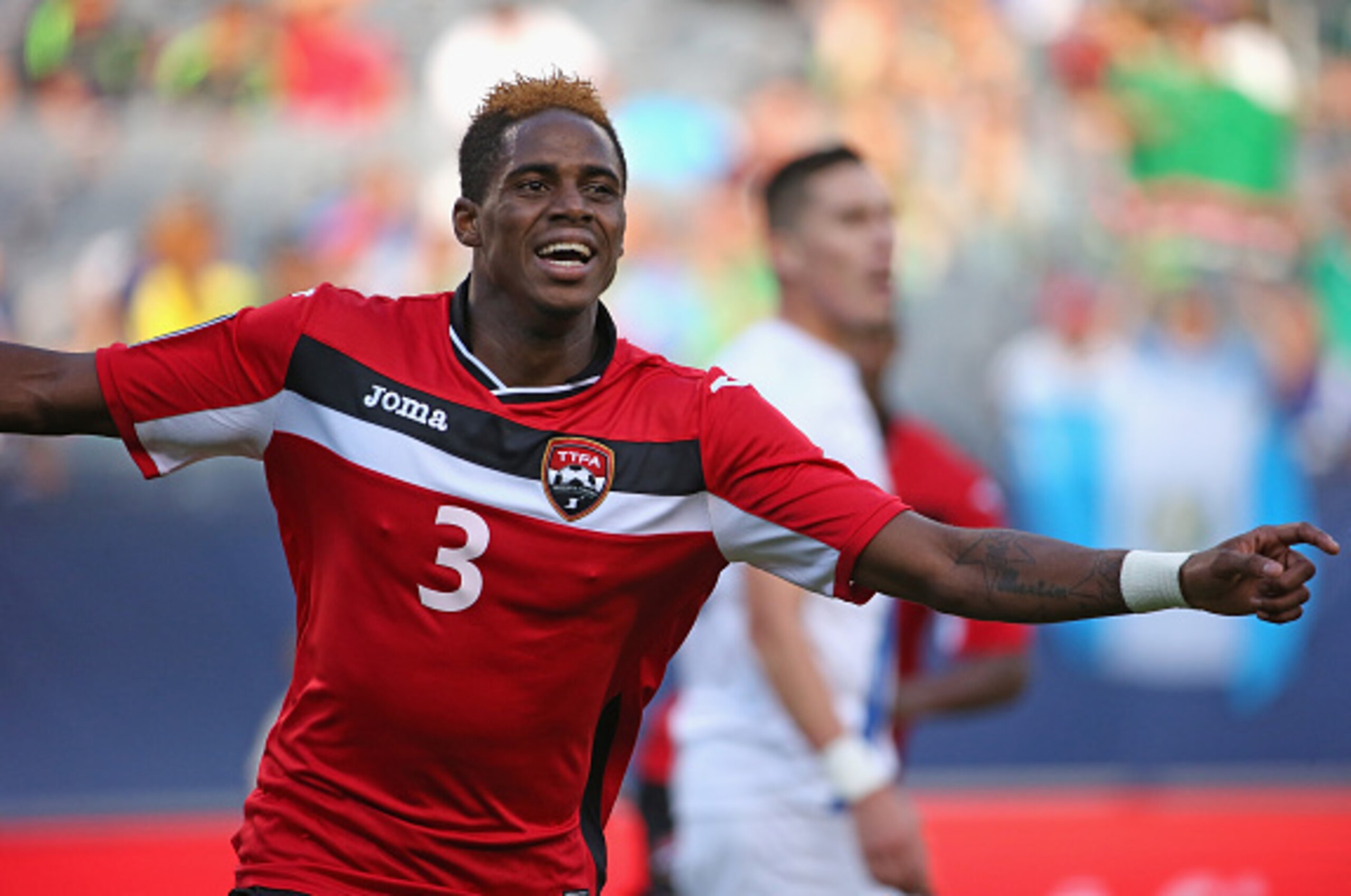 CHICAGO, IL - JULY 09: Joevin Jones #3 of Trinidad & Tobago celebrates a first half goal against Guatemala during a match in the 2015 CONCACAF Gold Cup at Soldier Field on July 9, 2015 in Chicago, Illinois. (Photo by Jonathan Daniel/Getty Images)