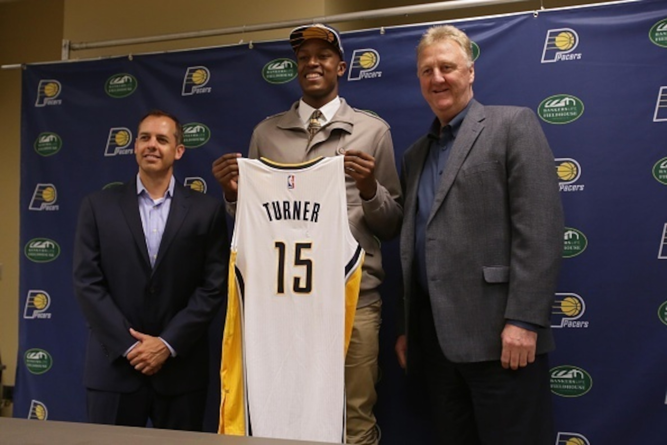 INDIANAPOLIS, IN - JUNE 26: Myles Turner, first round draft pick of the Indiana Pacers along Pacers head coach Frank Vogel and Pacers President Larry Bird take questions from the media on June 20, 2015 at Bankers Life Fieldhouse  in Indianapolis, Indiana.