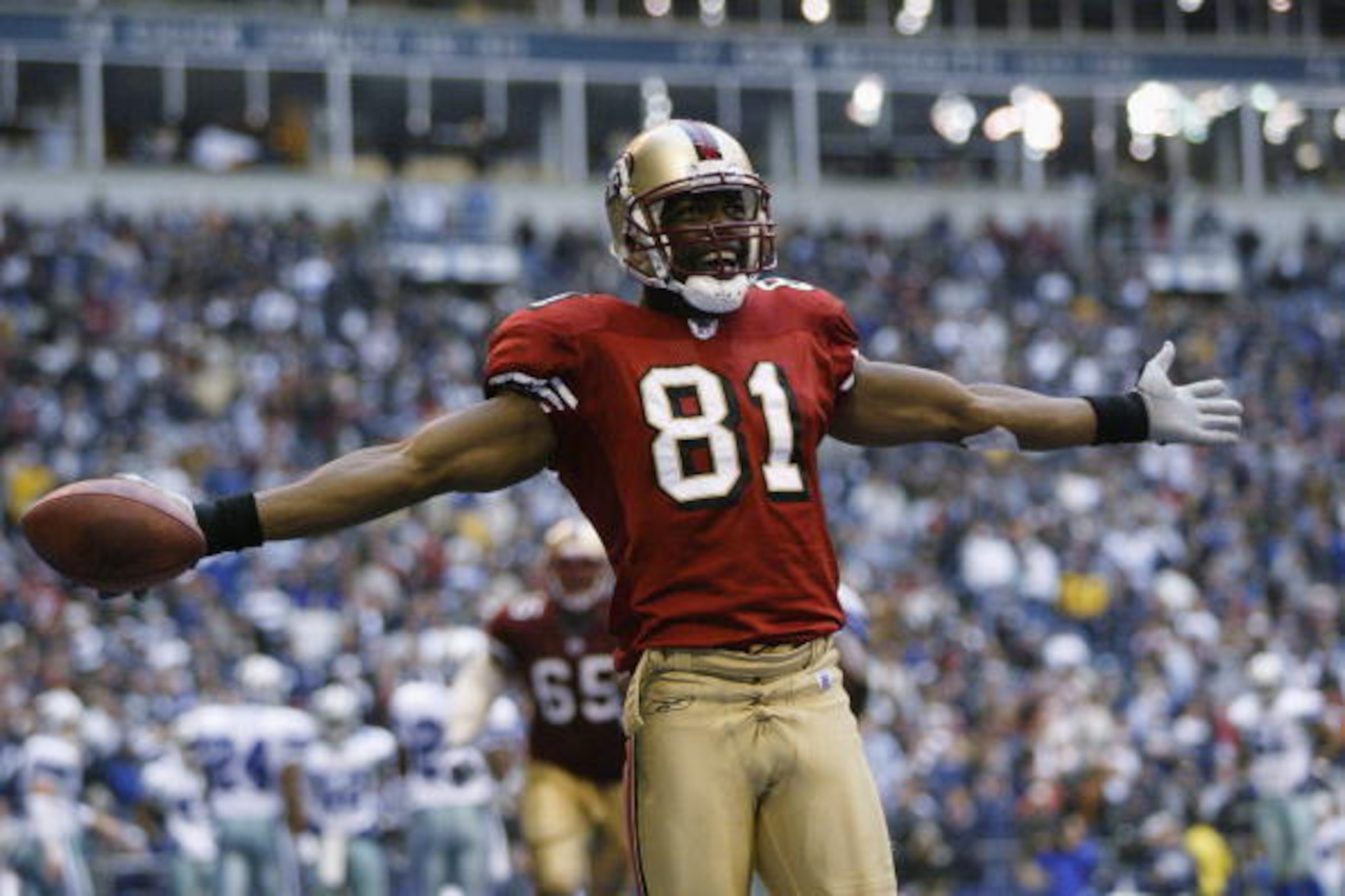 IRVING, TX - DECEMBER 8: Wide receiver Terrell Owens #81 of the San Francisco 49ers celebrates in the end zone after scoring a touchdown against the Dallas Cowboys with 12 seconds left on December 8, 2002 at Texas Stadium in Irving, Texas. The 49ers bea IRVING, TX - DECEMBER 8: Wide receiver Terrell Owens #81 of the San Francisco 49ers celebrates in the end zone after scoring a touchdown against the Dallas Cowboys with 12 seconds left on December 8, 2002 at Texas Stadium in Irving, Texas. The 49ers bea