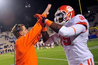 DURHAM, NC - NOVEMBER 03:  Coach Dabo Swinney and Isaiah Battle #79 of the Clemson Tigers celebrate after touchdown against the Duke Blue Devils during play at Wallace Wade Stadium on November 3, 2012 in Durham, North Carolina. Clemson won 56-20.  (Photo 