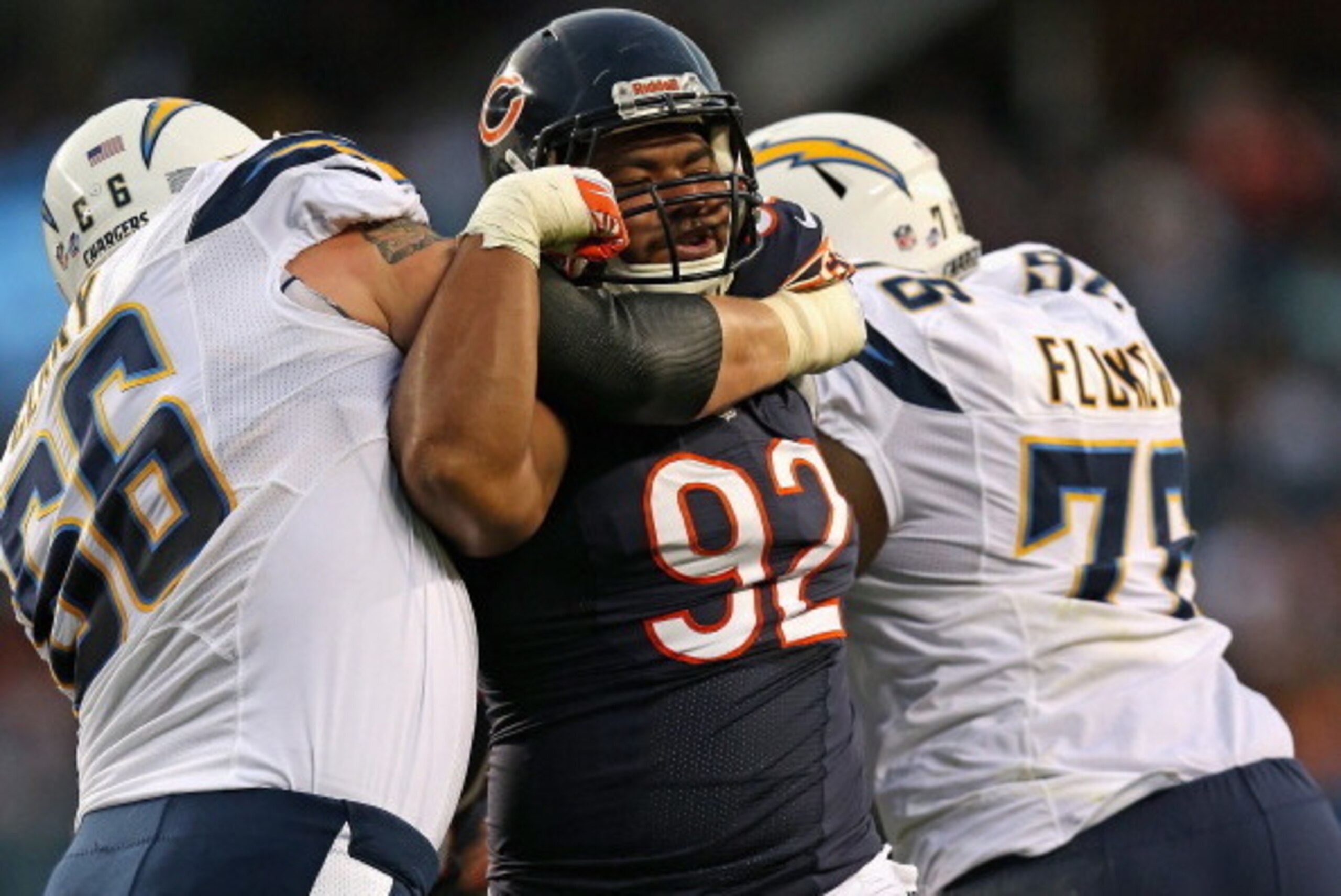 CHICAGO, IL - AUGUST 15: Stephen Paea #92 of the Chicago Bears rushes against Jeromey Clay #66 and D.J. Fluker #76 of the San Diego Chargers at Soldier Field on August 15, 2013 in Chicago, Illinois. (Photo by Jonathan Daniel/Getty Images)
