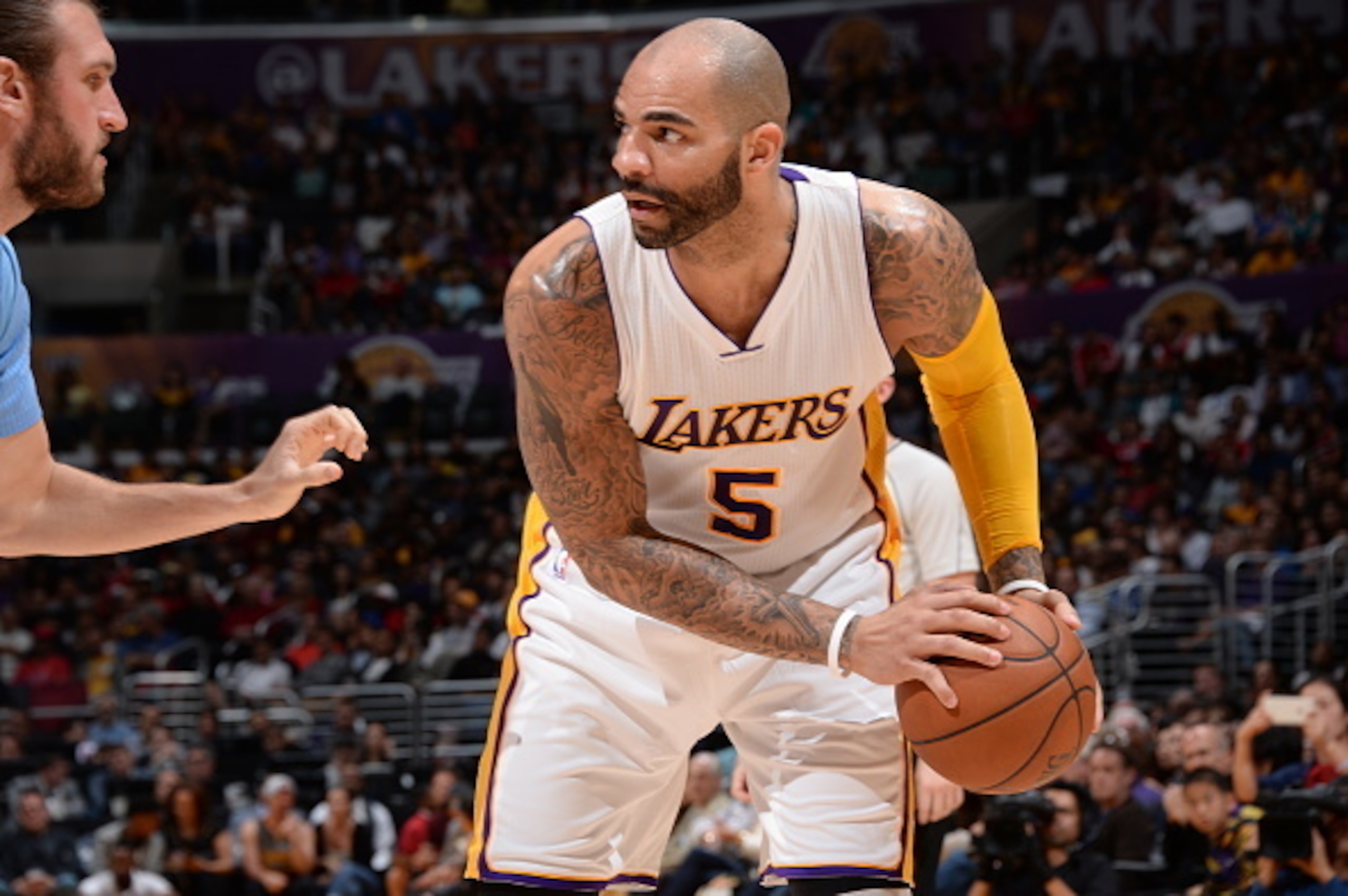 LOS ANGELES, CA - APRIL 5: Carlos Boozer #5 of the Los Angeles Lakers handles the ball against Spencer Hawes #10 of the Los Angeles Clippers on April 5, 2015 at Staples Center in Los Angeles, California. NOTE TO USER: User expressly acknowledges and agre LOS ANGELES, CA - APRIL 5: Carlos Boozer #5 of the Los Angeles Lakers handles the ball against Spencer Hawes #10 of the Los Angeles Clippers on April 5, 2015 at Staples Center in Los Angeles, California. NOTE TO USER: User expressly acknowledges and agre