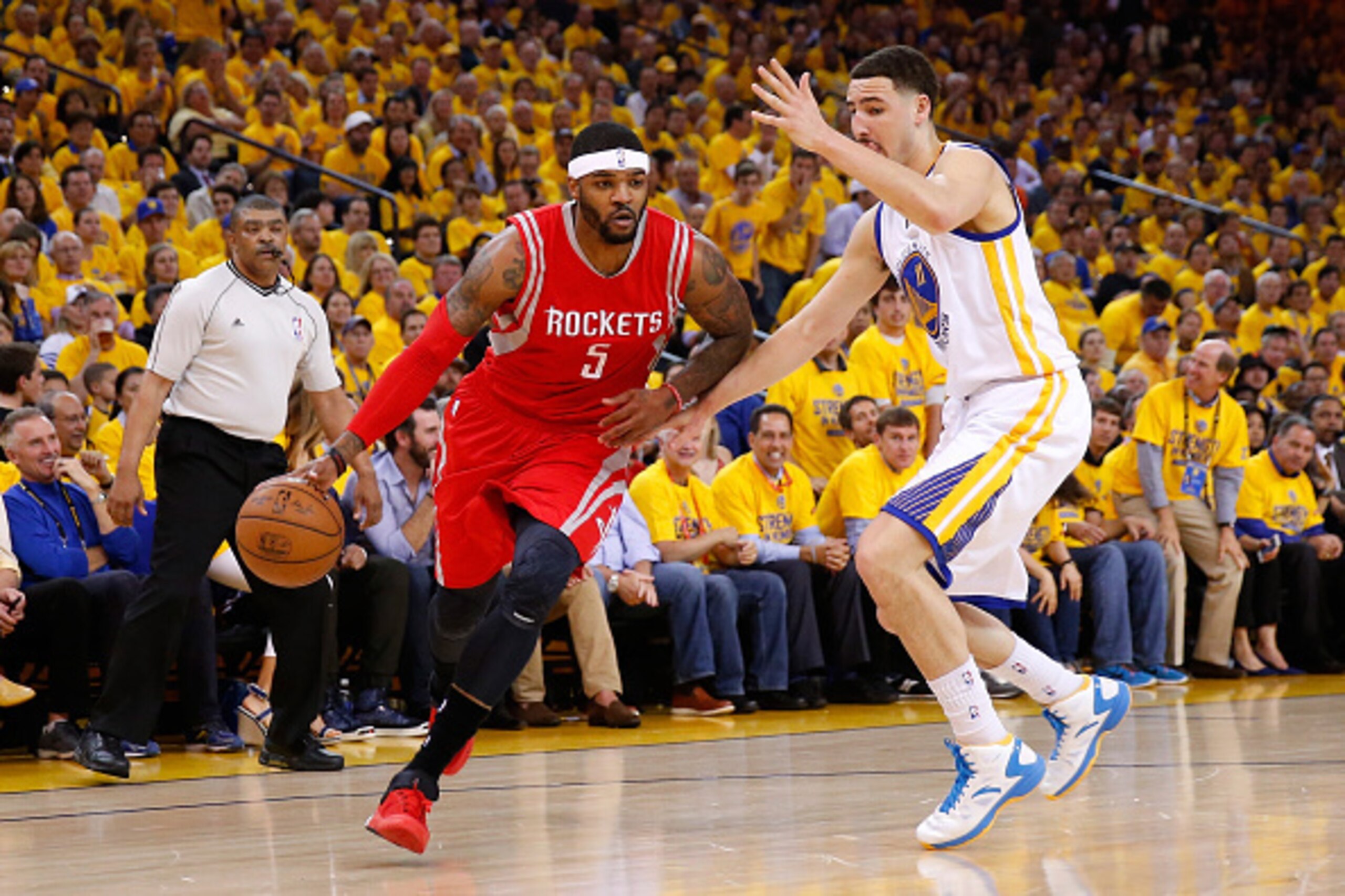 OAKLAND, CA - MAY 27: Josh Smith #5 of the Houston Rockets drives on Klay Thompson #11 of the Golden State Warriors in the first half during game five of the Western Conference Finals of the 2015 NBA Playoffs at ORACLE Arena on May 27, 2015 in Oakland, C OAKLAND, CA - MAY 27: Josh Smith #5 of the Houston Rockets drives on Klay Thompson #11 of the Golden State Warriors in the first half during game five of the Western Conference Finals of the 2015 NBA Playoffs at ORACLE Arena on May 27, 2015 in Oakland, C