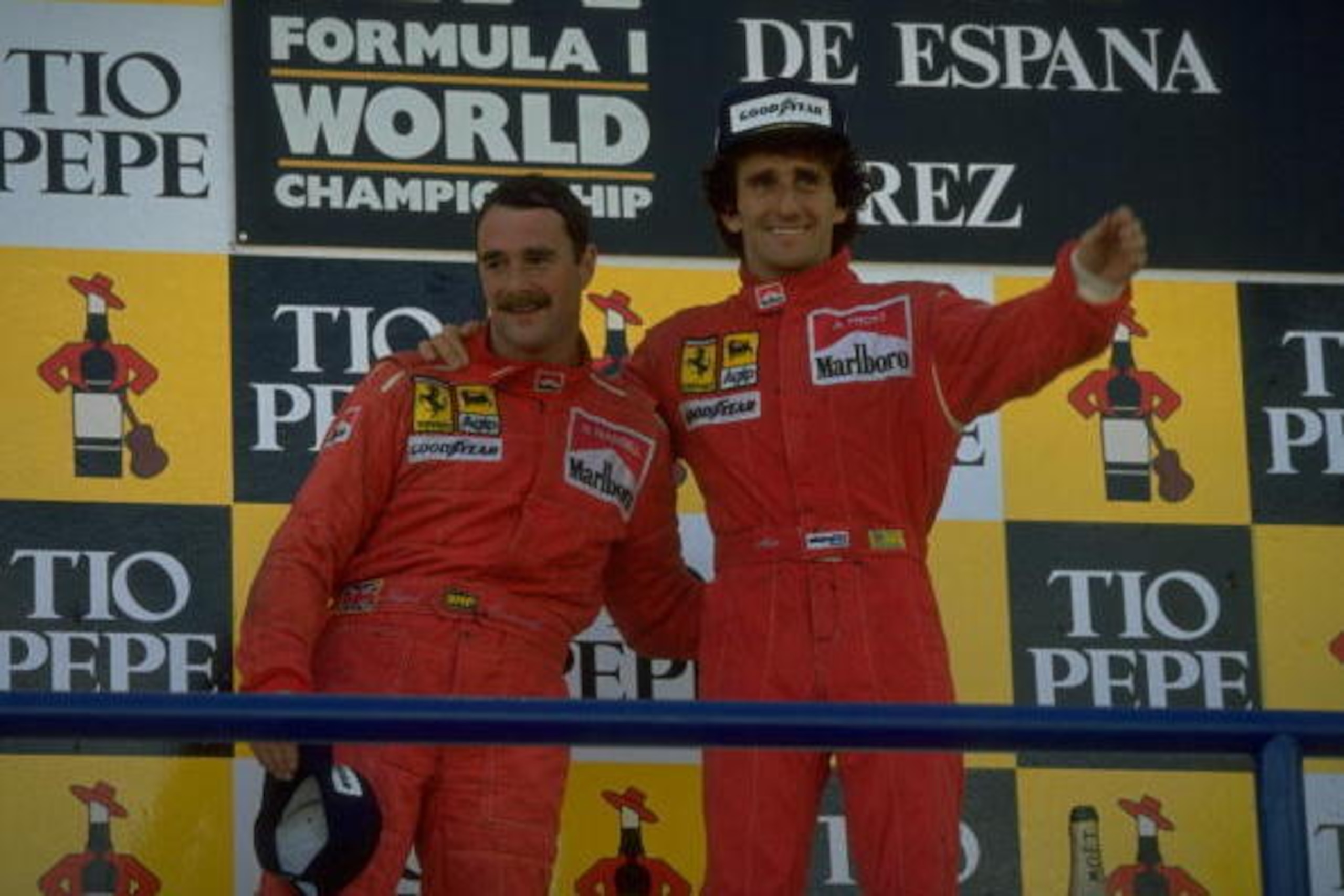 1990:  Scuderia Ferrari drivers Nigel Mansell (left) of Great Britain and Alain Prost (right) of France stand on the winners'' podium after the Spanish Grand Prix at the Jerez circuit in Spain. Prost finished in first place and Mansell in second. \ Mandat