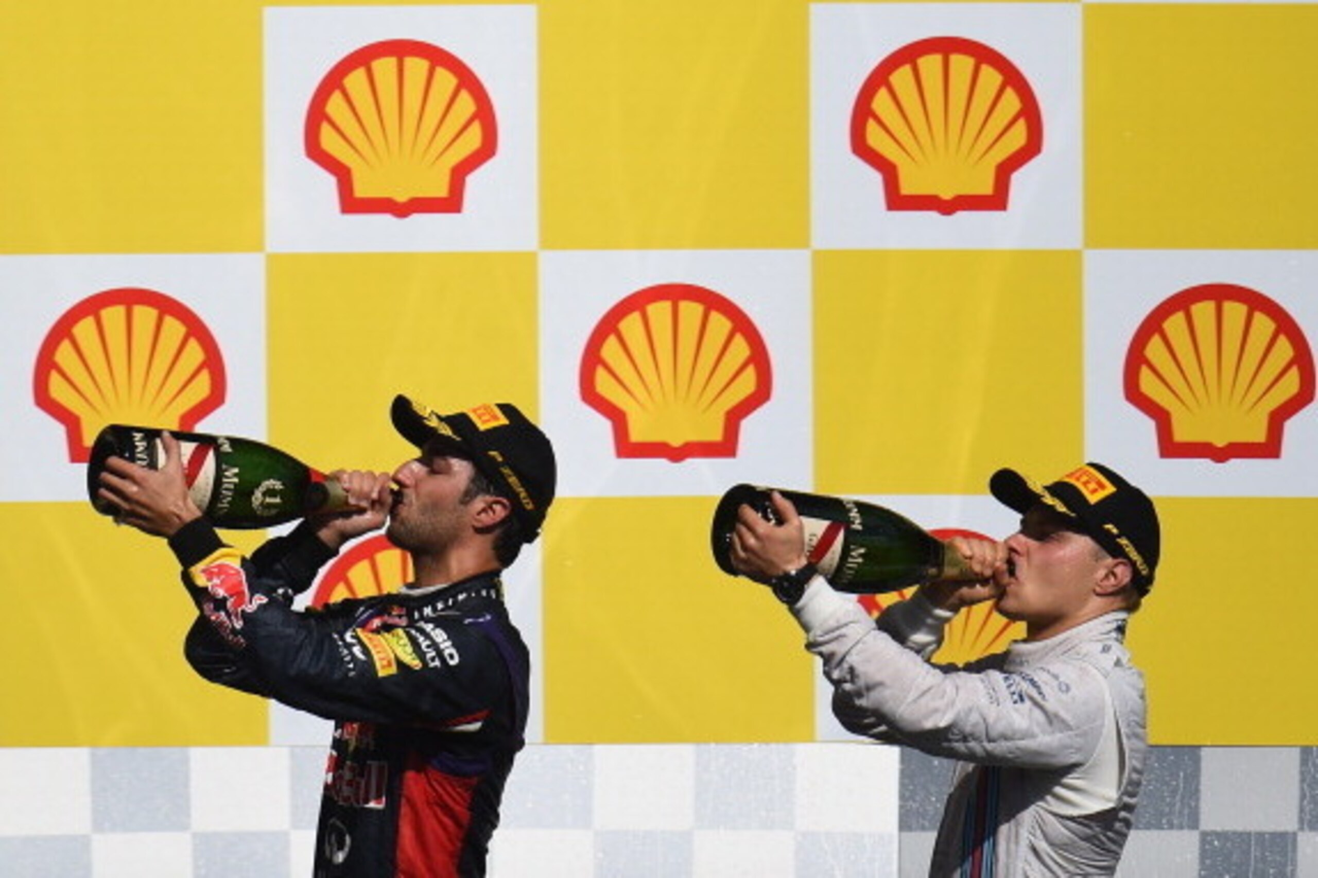 SPA, BELGIUM - AUGUST 24:  Daniel Ricciardo of Australia and Infiniti Red Bull Racing and Valtteri Bottas of Finland and Williams celebrate on the podium during the Belgian Grand Prix at Circuit de Spa-Francorchamps on August 24, 2014 in Spa, Belgium.  (P