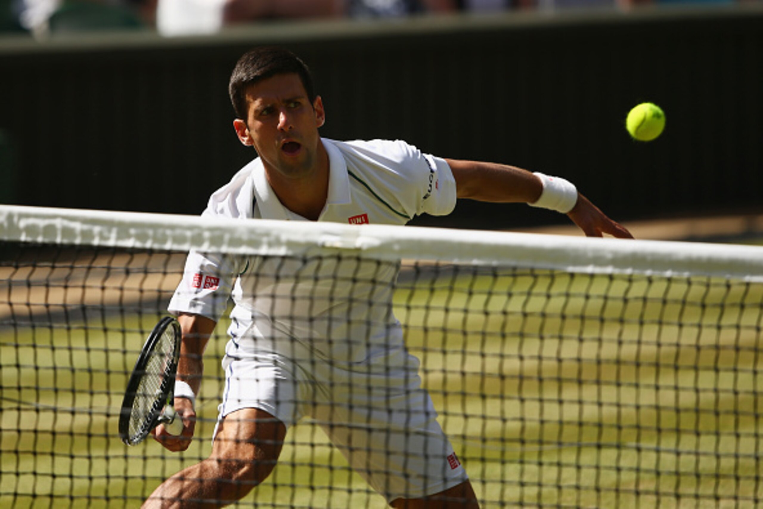 LONDON, ENGLAND - JULY 10:  Novak Djokovic of Serbia plays a forehand in the Gentlemens Singles Semi Final match against Richard Gasquet of France during day eleven of the Wimbledon Lawn Tennis Championships at the All England Lawn Tennis and Croquet Club