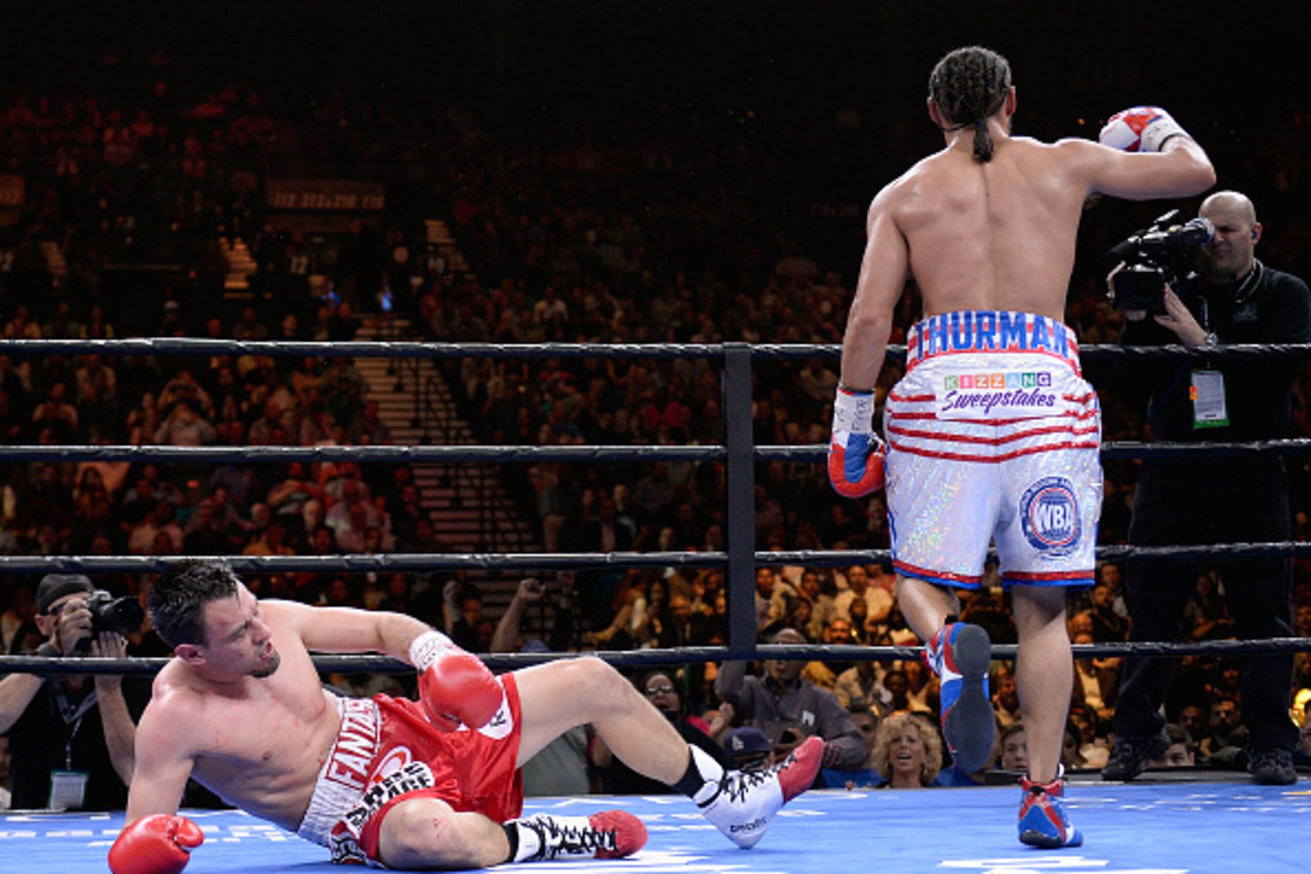 LAS VEGAS, NV - MARCH 07:  Robert Guerrero (red trunks) is knocked down by Keith Thurman (white trunks) during a Premier Boxing Champions bout in the MGM Grand Garden Arena on March 7, 2015 in Las Vegas, Nevada.  (Photo by Harry How/Getty Images)