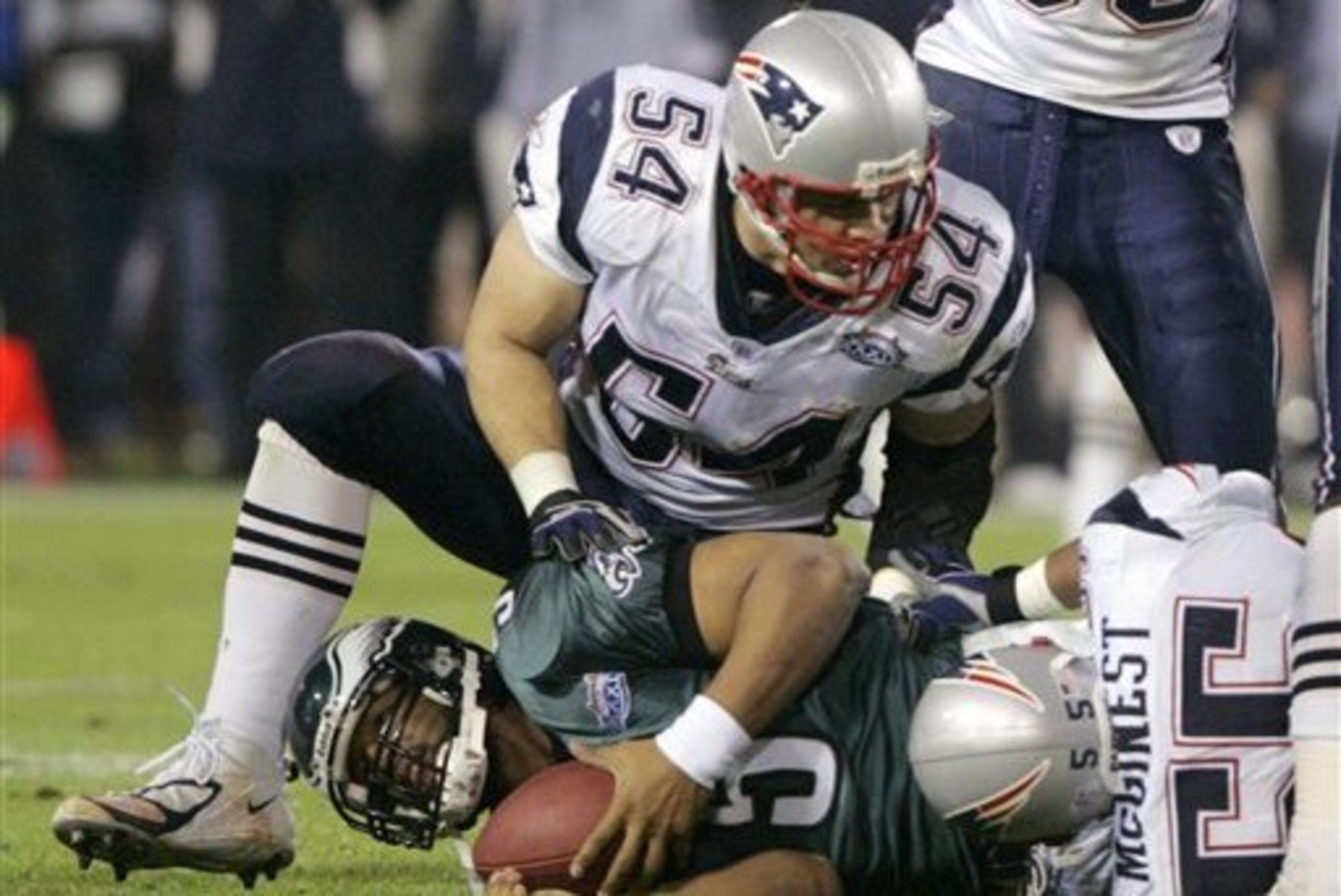 Tedy Bruschi sacking Donovan McNabb in the Super Bowl.