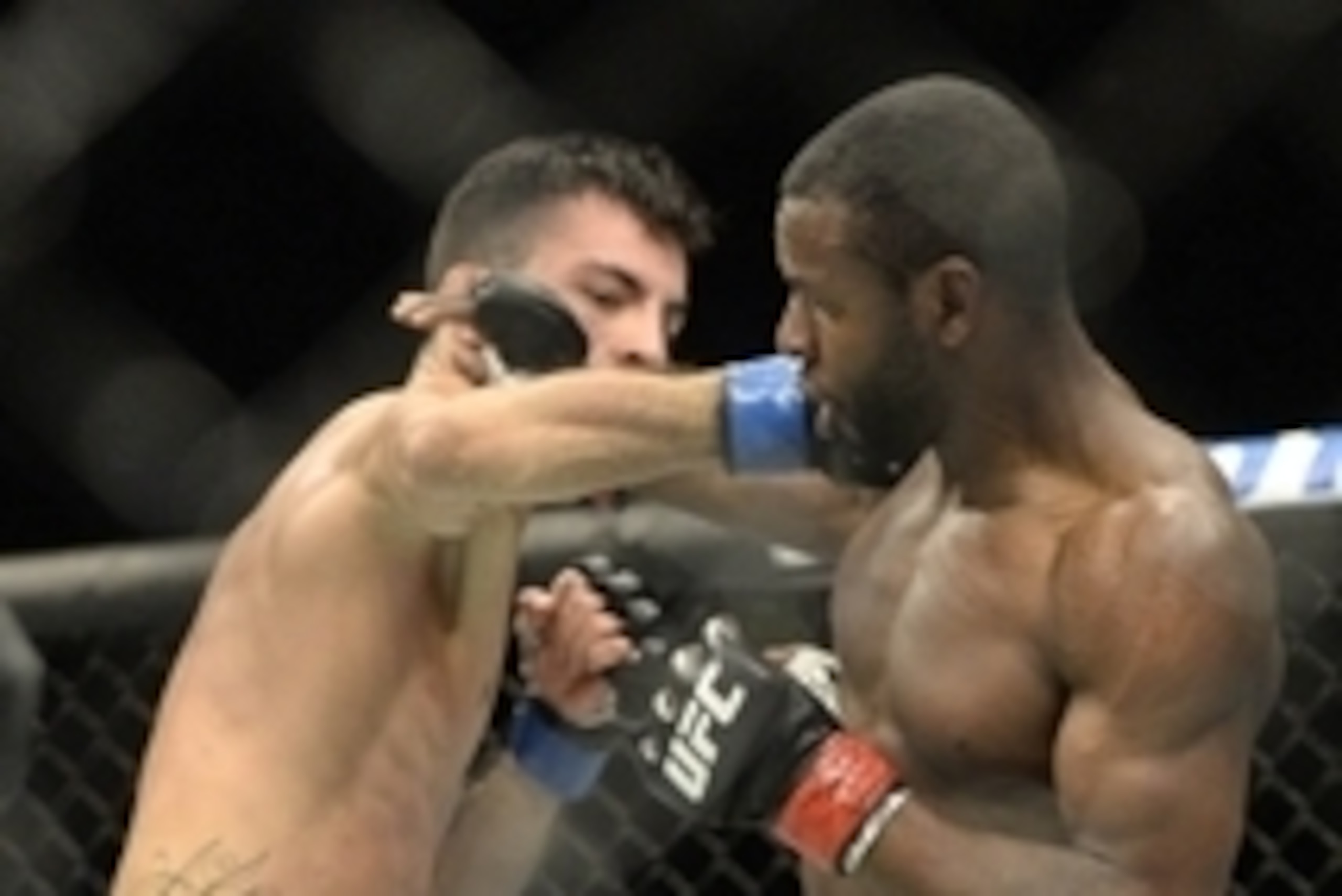 Apr 25, 2015; Montreal, Quebec, CAN; Yves Jabouin (red) and Thomas Almeida (blue) fight during their bantamweight bout during UFC 186 at Bell Centre. Mandatory Credit: Eric Bolte-USA TODAY Sports