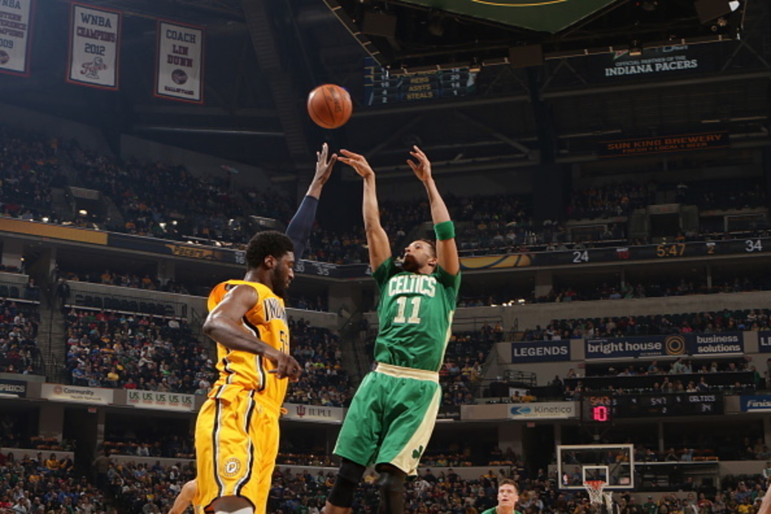 INDIANAPOLIS, IN - MARCH 14:  Evan Turner #11 of the Boston Celtics shoots against Roy Hibbert #55 of the Indiana Pacers on March 14, 2015 at Bankers Life Fieldhouse in Indianapolis, Indiana.  NOTE TO USER: User expressly acknowledges and agrees that, by 