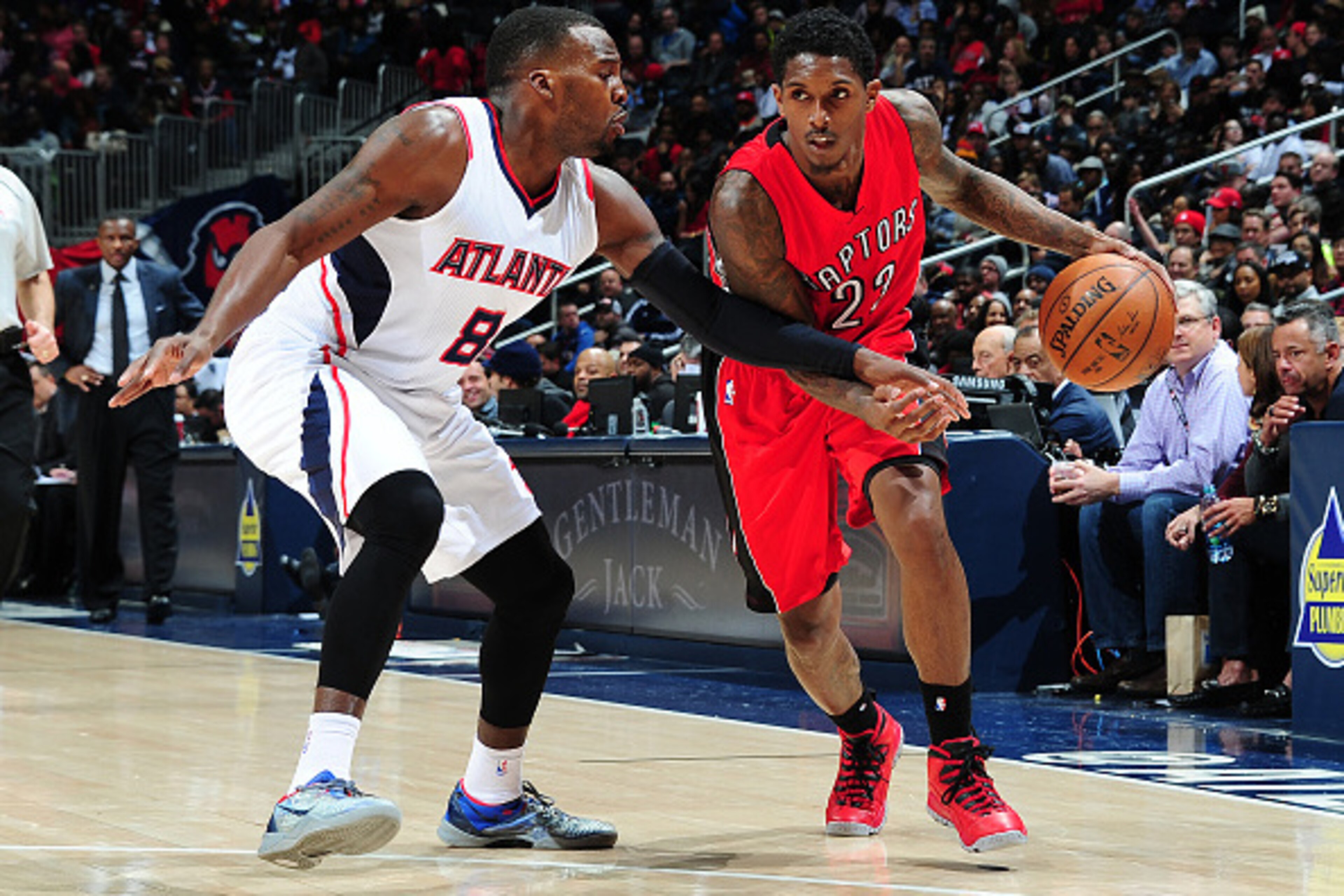 ATLANTA, GA - FEBRUARY 20: Lou Williams #23 of the Toronto Raptors drives against Shelvin Mack #8 of the Atlanta Hawks on February 20, 2015 at Philips Arena in Atlanta, Georgia. NOTE TO USER: User expressly acknowledges and agrees that, by downloading an ATLANTA, GA - FEBRUARY 20: Lou Williams #23 of the Toronto Raptors drives against Shelvin Mack #8 of the Atlanta Hawks on February 20, 2015 at Philips Arena in Atlanta, Georgia. NOTE TO USER: User expressly acknowledges and agrees that, by downloading an