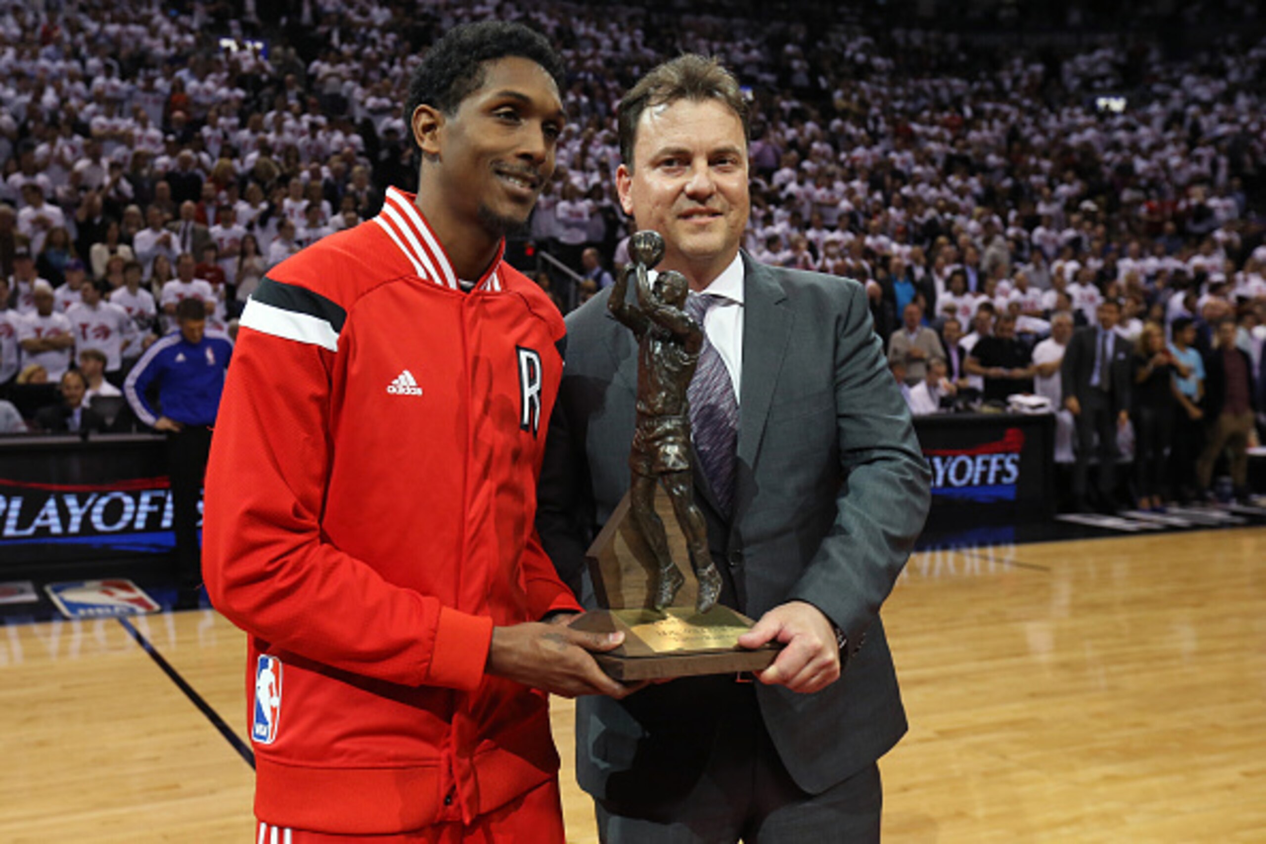 TORONTO,ON - APRIL 21: Louis Williams #23 of the Toronto Raptors receivs the Sixth Man of the Year Award before the game against the Washington Wizards during Game Two of the Eastern Conference Quarterfinals of the 2015 NBA Playoffs at the Air Canada Cen TORONTO,ON - APRIL 21: Louis Williams #23 of the Toronto Raptors receivs the Sixth Man of the Year Award before the game against the Washington Wizards during Game Two of the Eastern Conference Quarterfinals of the 2015 NBA Playoffs at the Air Canada Cen